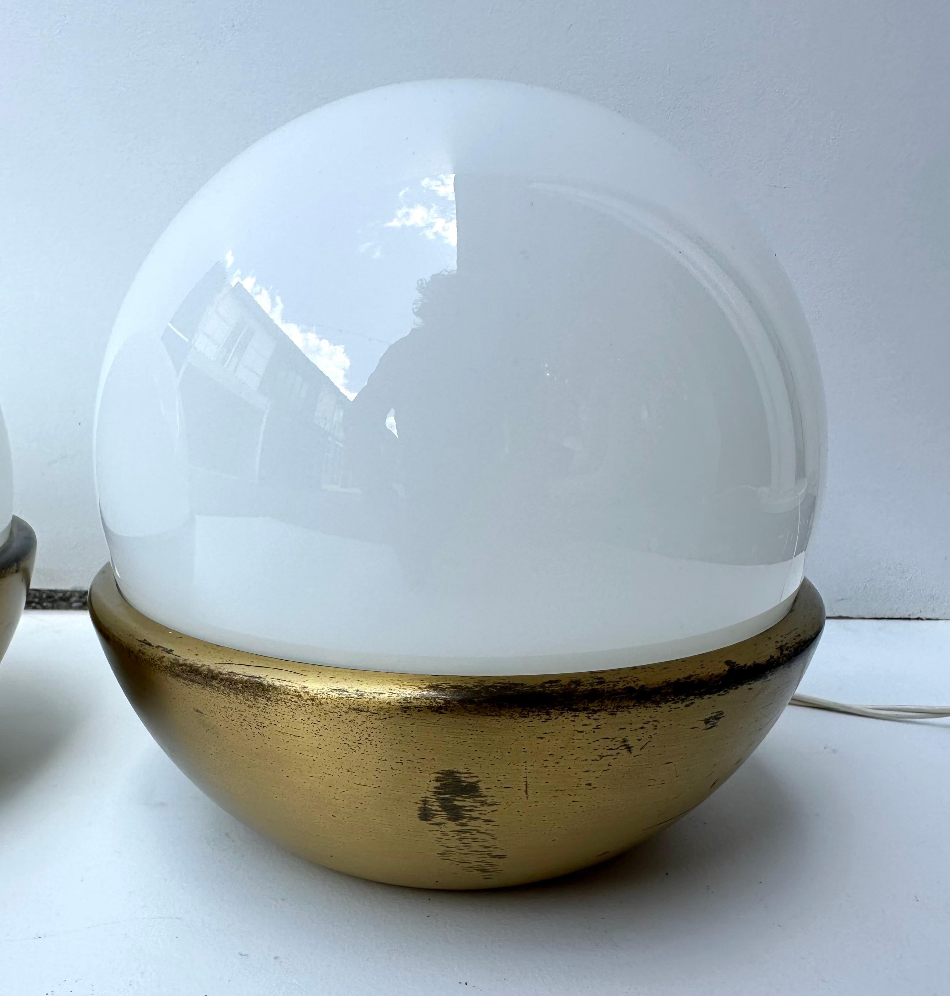 Italian Pair of Ball Lamps Brass and Opaline Murano Glass.  Italy, 1970s For Sale