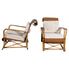Pair of bamboo and rattan armchairs with fabric cushions, England, circa 1920.