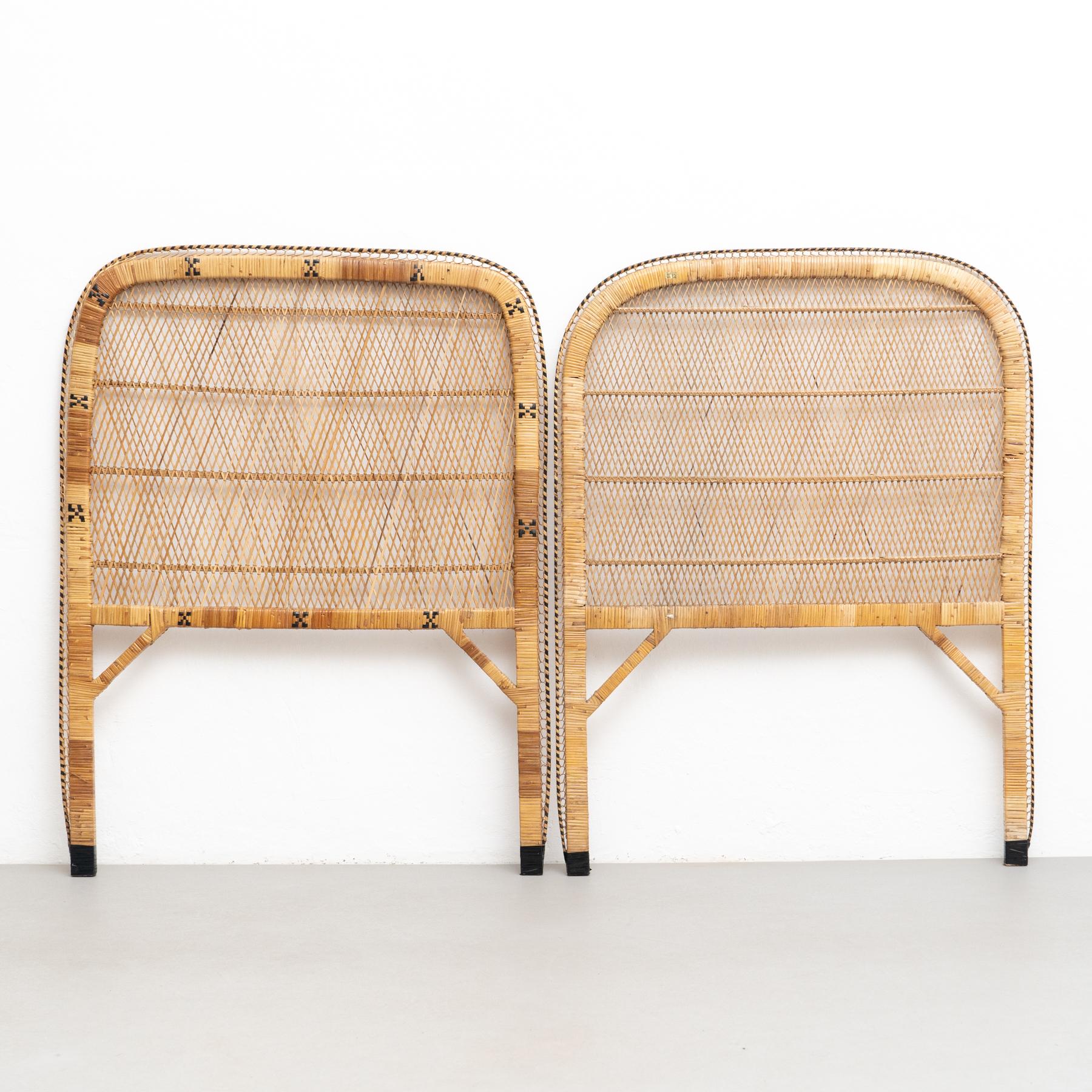 Pair of Mid-Century Modern bamboo and rattan headboard, circa 1960.

Traditionally manufactured in Philippines.

By unknown designer.

In original condition with minor wear consistent of age and use, preserving a beautiful