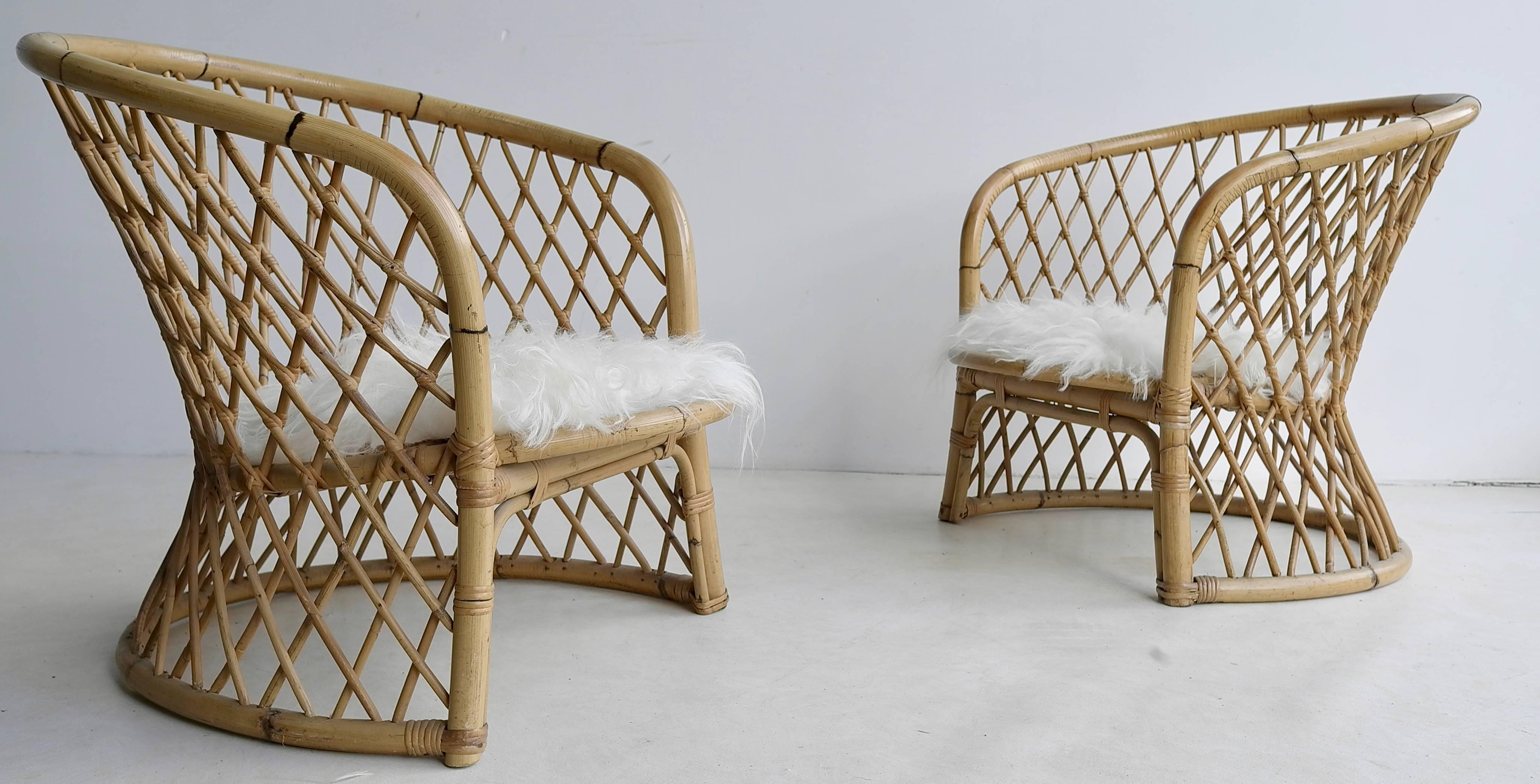 Pair of bamboo armchairs with woollen seats, 1960s

These chairs would look great inside an interior or outside on a porch.
