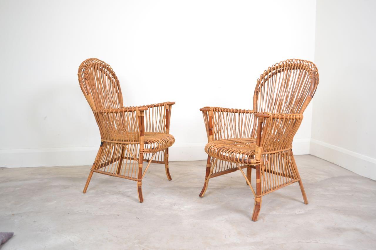 Very stylish pair of bamboo chairs manufactured by Bonacina
Italy circa 1970. Good condition and comfortable chairs with a 
nice organic patina.