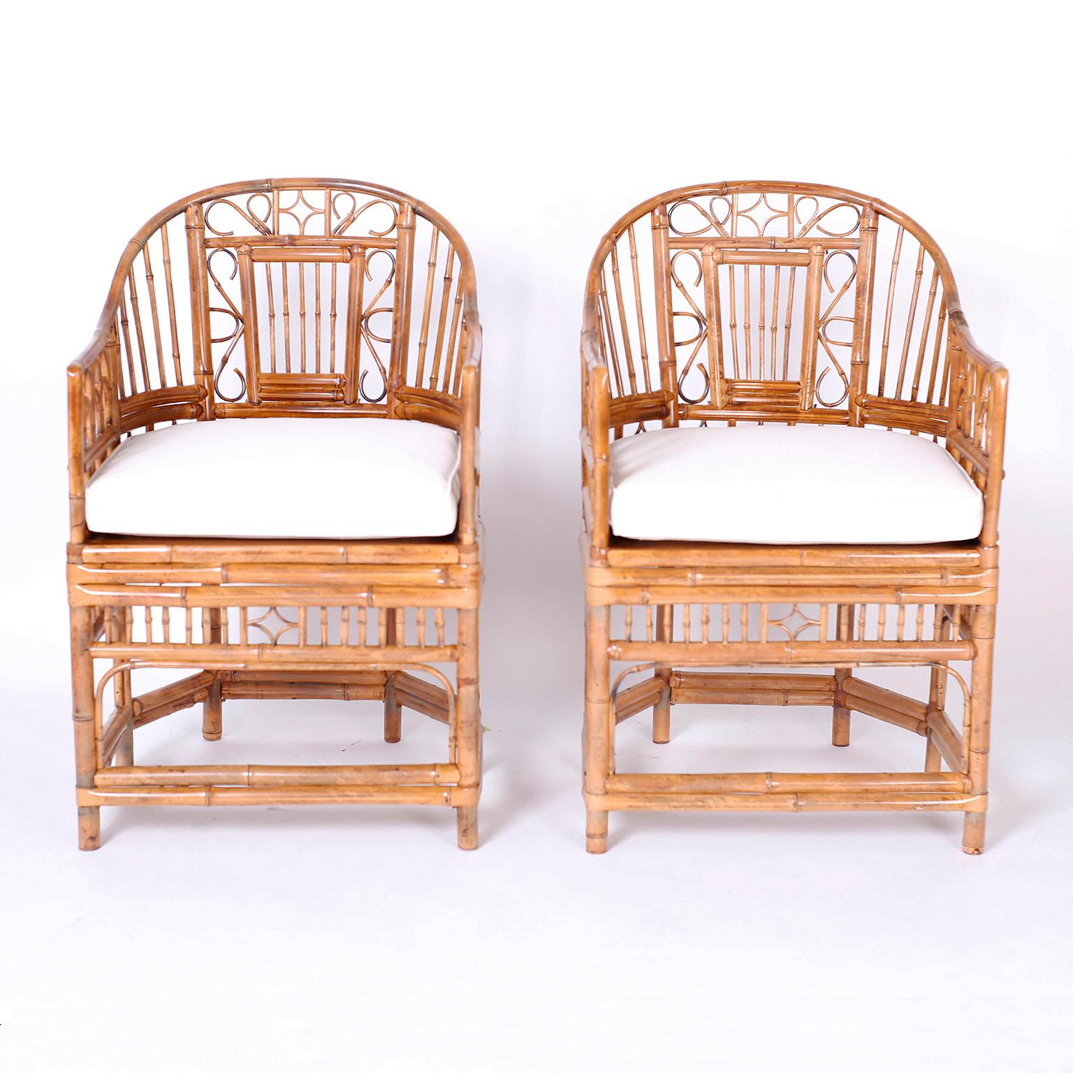 Pair of mid century chairs with caned seats crafted with bamboo and bent bamboo in a classic Brighton Pavilion form. 

Seat height with cushion: 20