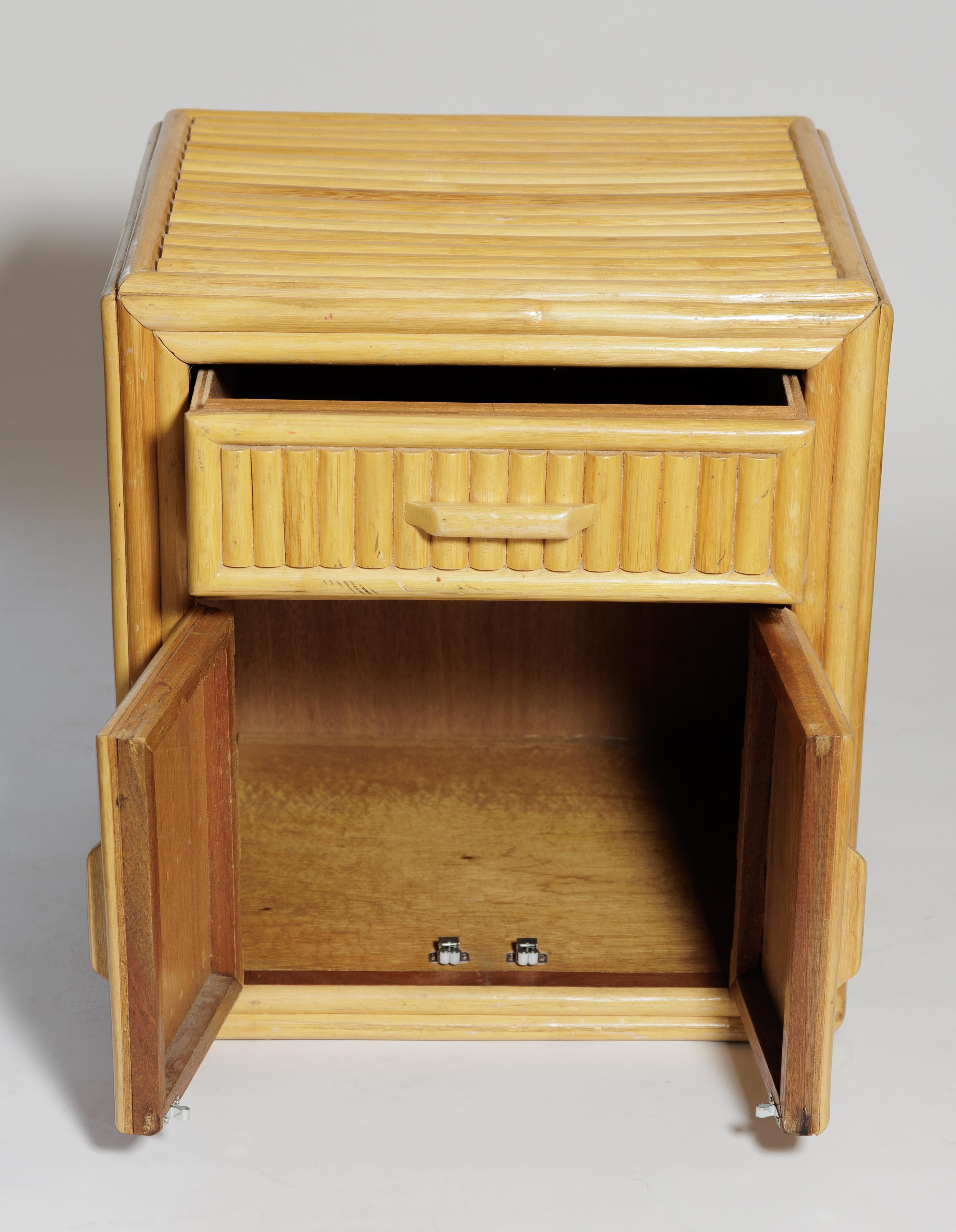 Pair of bamboo cabinets with drawer and doors.