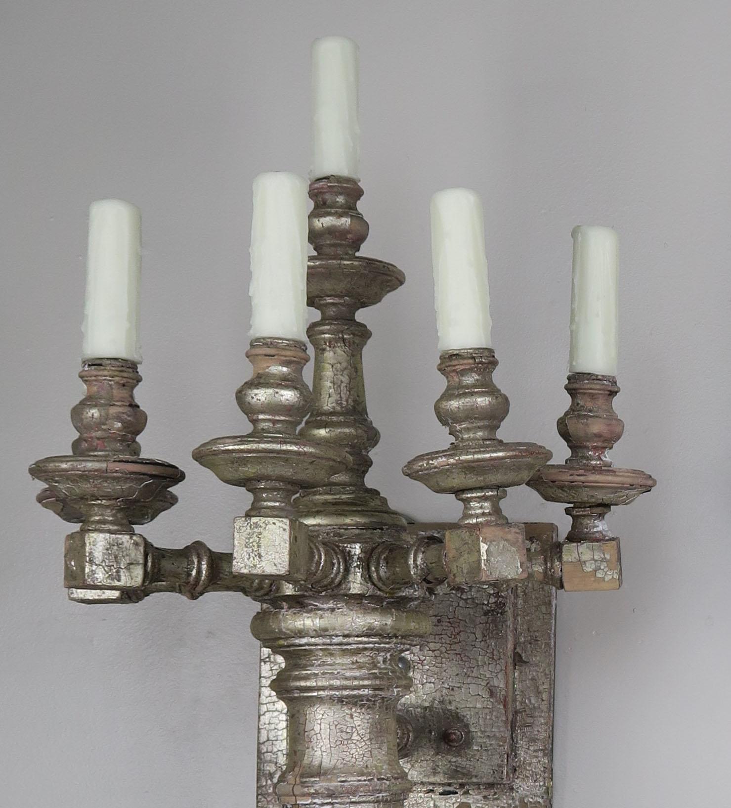 Pair of midcentury Italian bamboo motif 6-light silver gilt sconces that are newly rewired with drip wax candle covers. The silver is worn throughout and the wood can be seen underneath in areas.