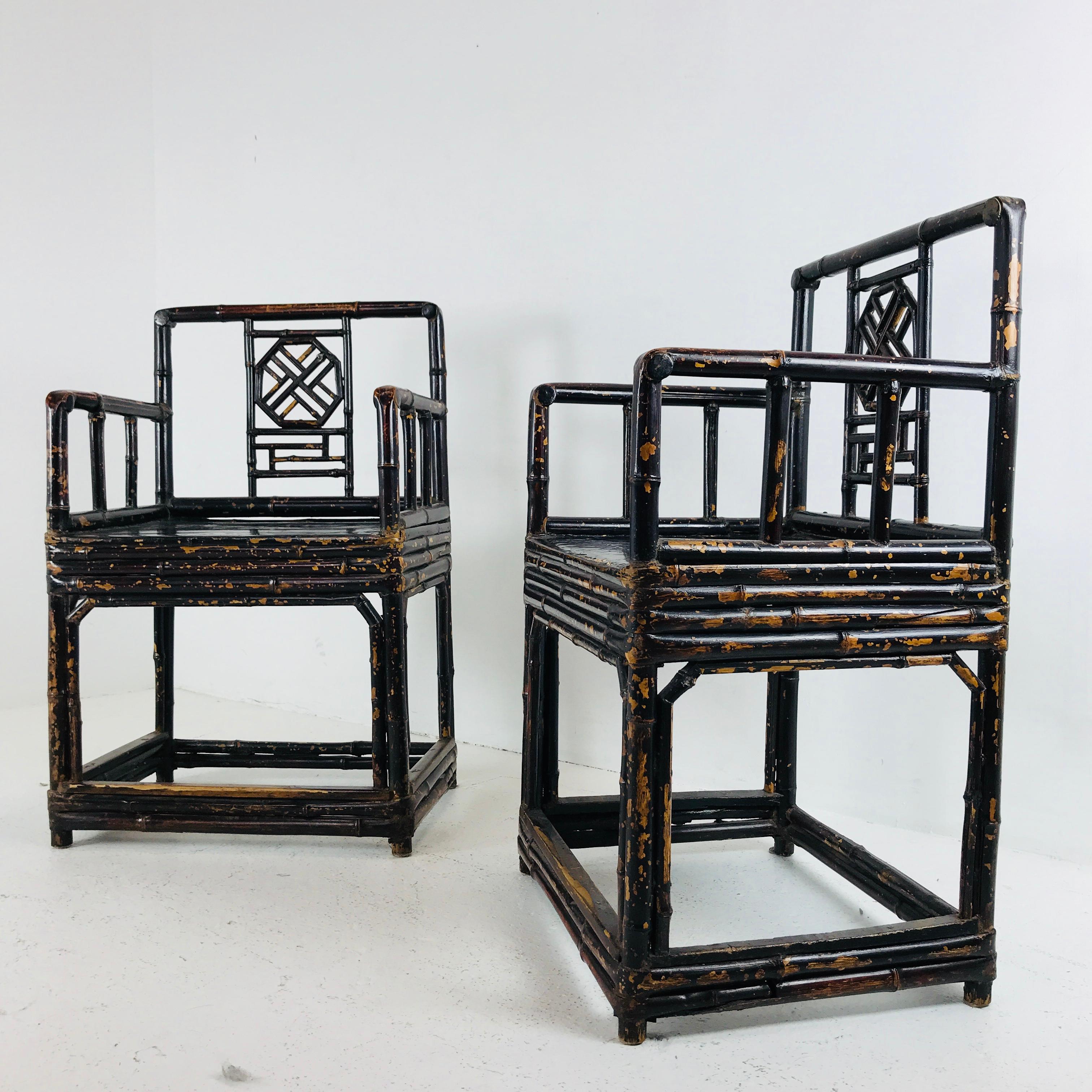 Pair of bamboo rattan chinoiserie armchairs by Brighton Pavillion. Chairs do show signs of wear from use and age. Refinishing is recommended.

Dimensions:
21