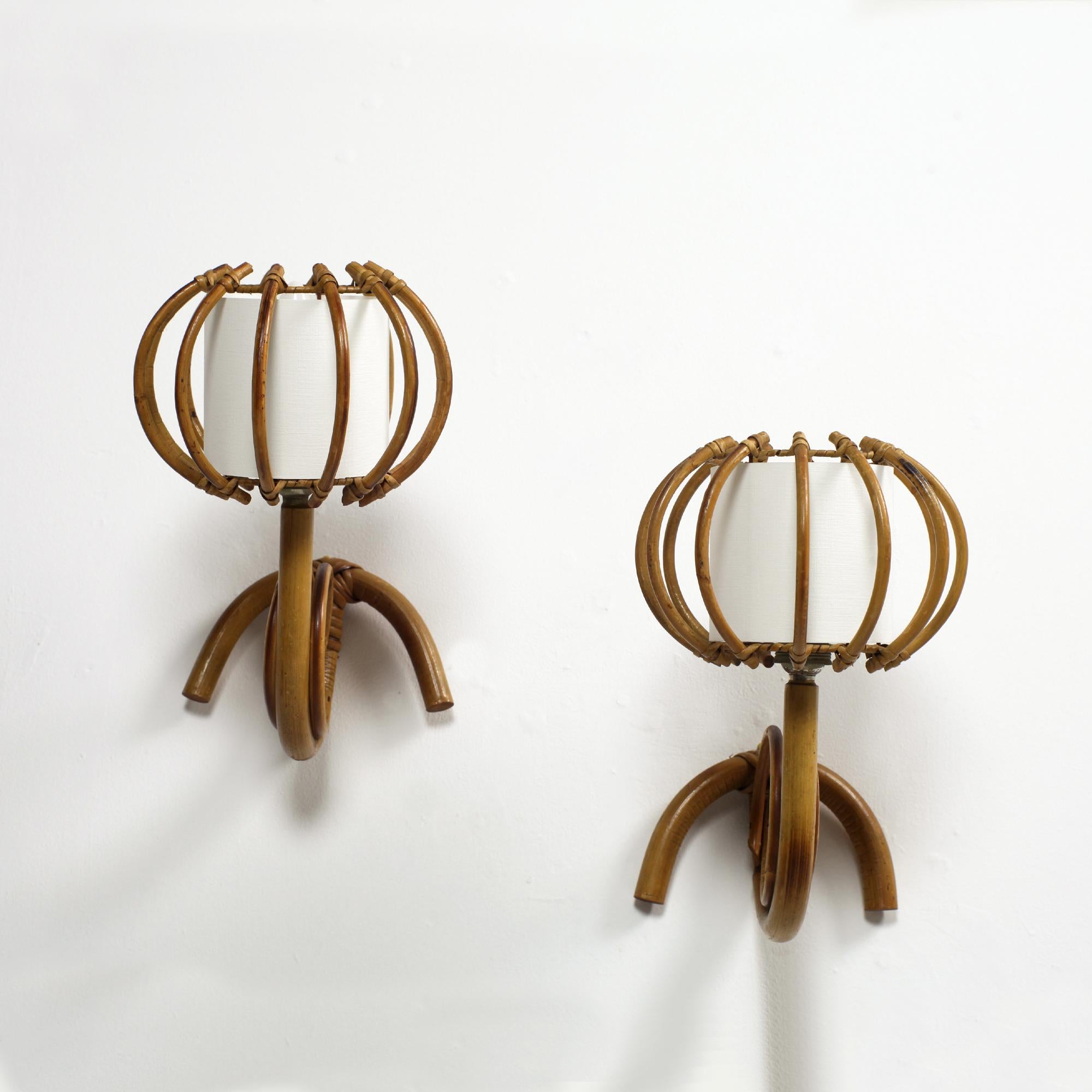 Charming pair of bamboo and rattan wall light by Louis Sognot. France 1960.
Lovely example of  French Riviera design from the 60s
Bamboo and rattan structure with ivory paper shade.
B22 socket.
Support led bulb.
Good condition.