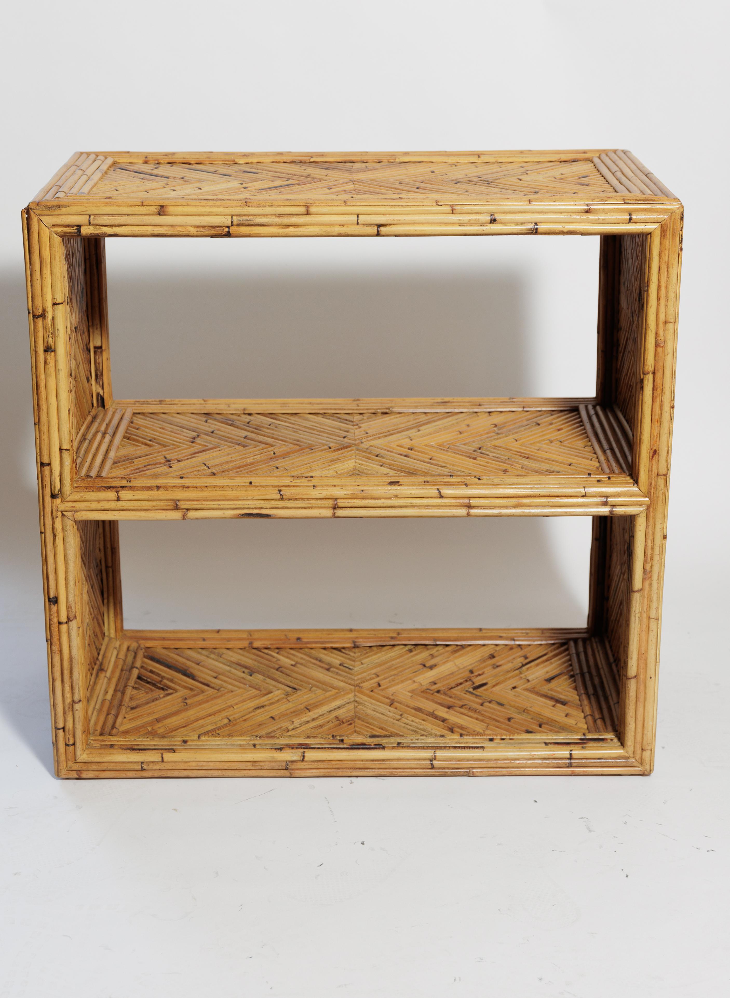 A pair of open back bamboo reed shelf units.