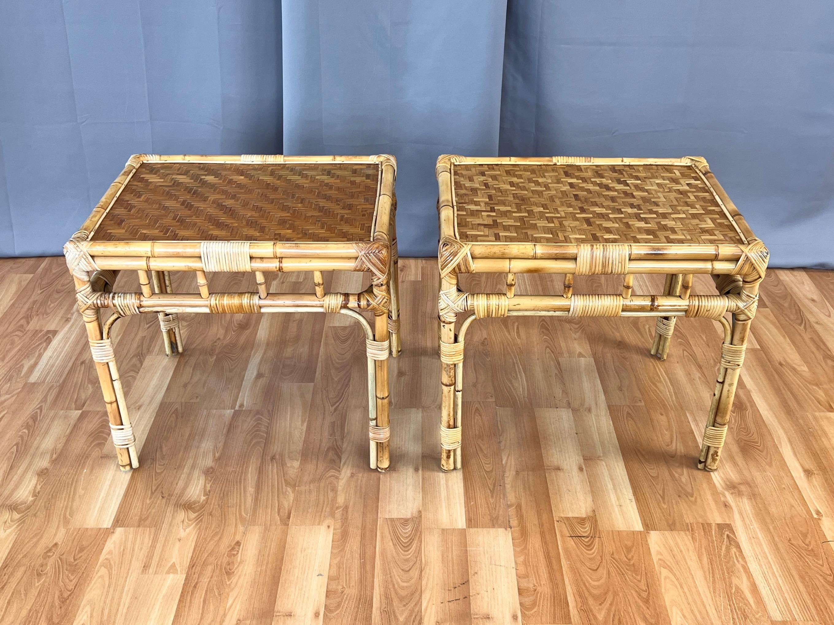 A very nice pair of circa 1970 bamboo side tables or end tables with distinctive herringbone pattern woven cane tops.

Hand-crafted natural bamboo frames feature hand-woven and wrapped cane accents throughout. Notable for attractive and less
