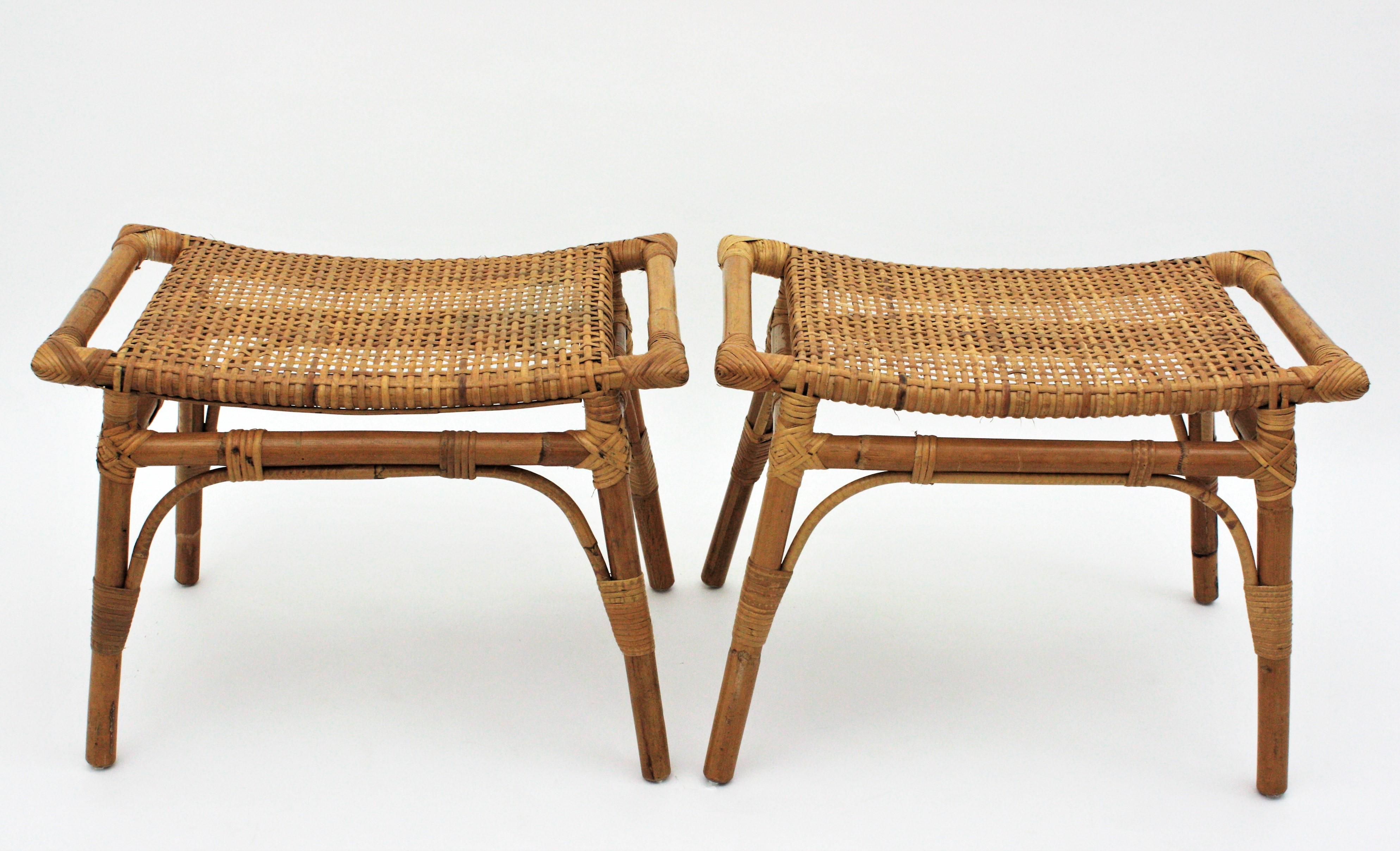 Eye-catching pair of modernist bamboo and woven rattan / wicker rectangular stools or small benches, Spain, 1960s.
These stools have a design with handles at both sides inspired in Hans J Wegner stools.
Very well constructed all made by hand with