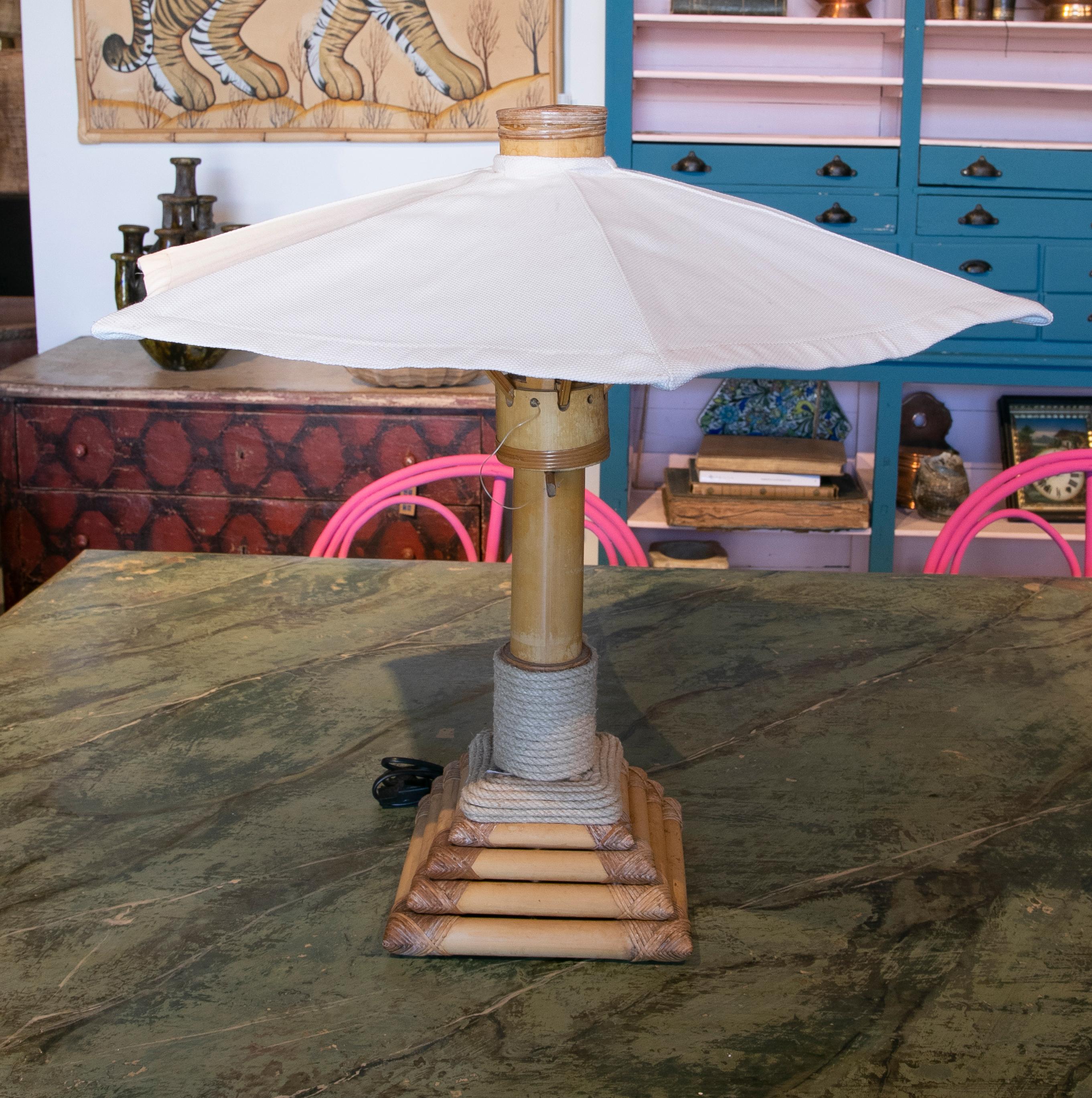 Pair of bamboo table lamps with garden parasols shape from the 1970ies.
