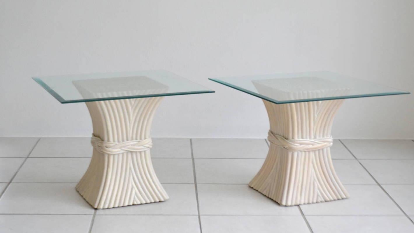 Striking pair of reeded bamboo side tables, circa 1970s. These tables made of cinched bamboo / rattan poles have been designed with a whitewash finish and square beveled glass tops. The pair could alternately to be used as a cocktail / coffee table.