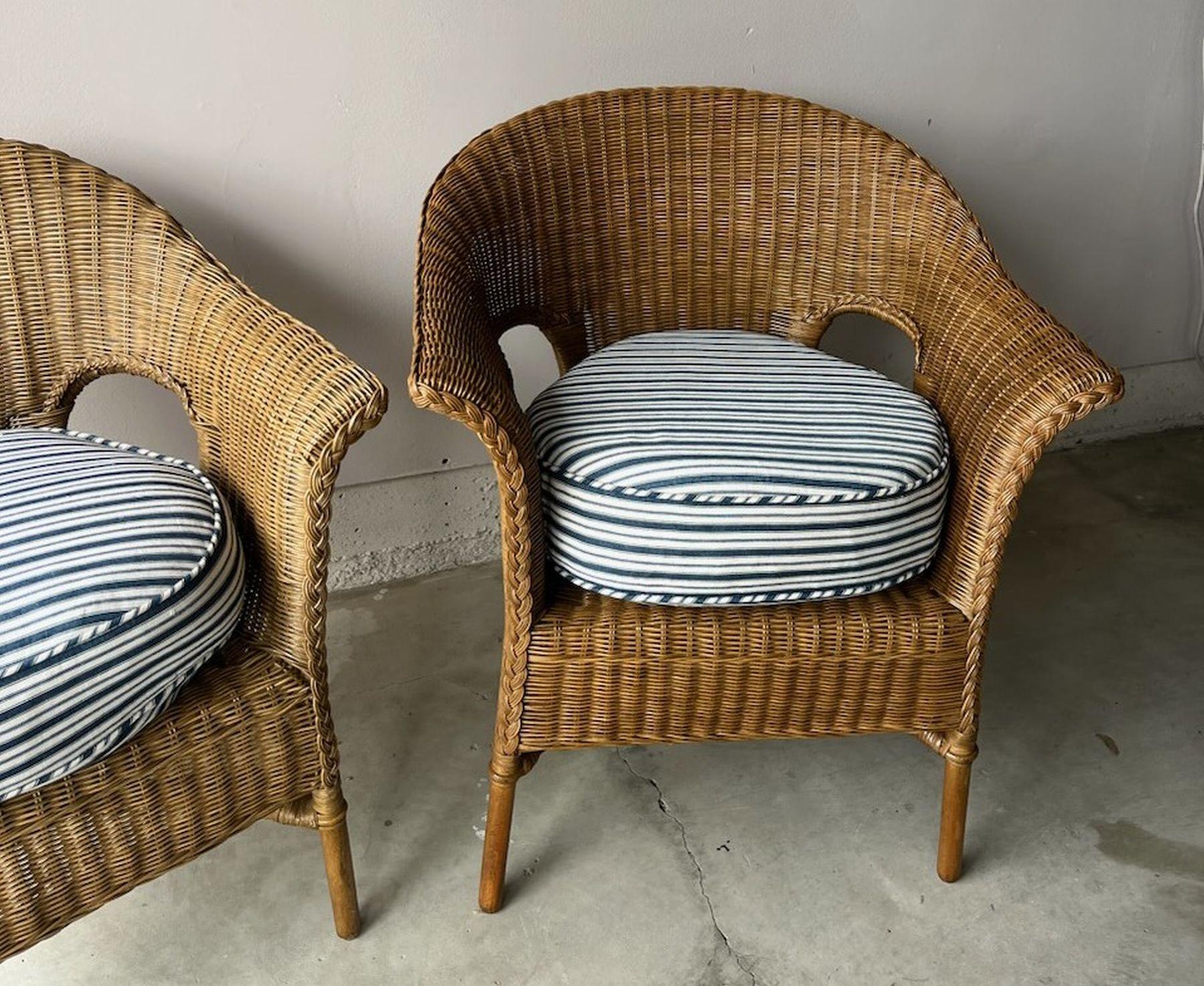 Mid 2othc Century Bar Harbor Style Wicker with all weather Protect-ant. May be used indoor or outdoor. chairs with custom made seat cushions using vintage blue and white striped ticking. Superb comfort with a strong yet light weight frame. These are