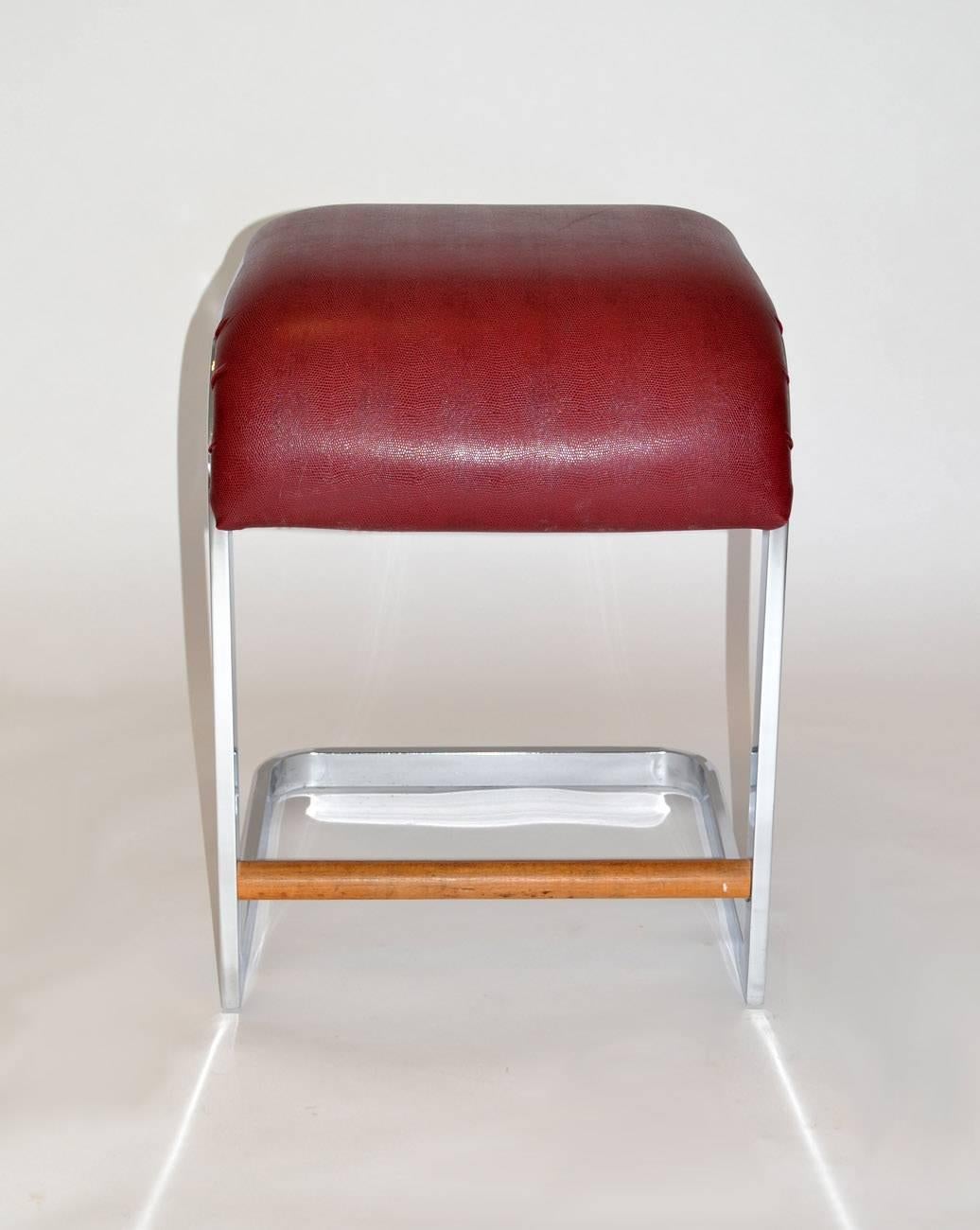 Pair of leather and chrome bar / counter stools by Design Institute of America, circa 1970s. Cantilevered chrome frame, embossed leather, wood. Signed.

 