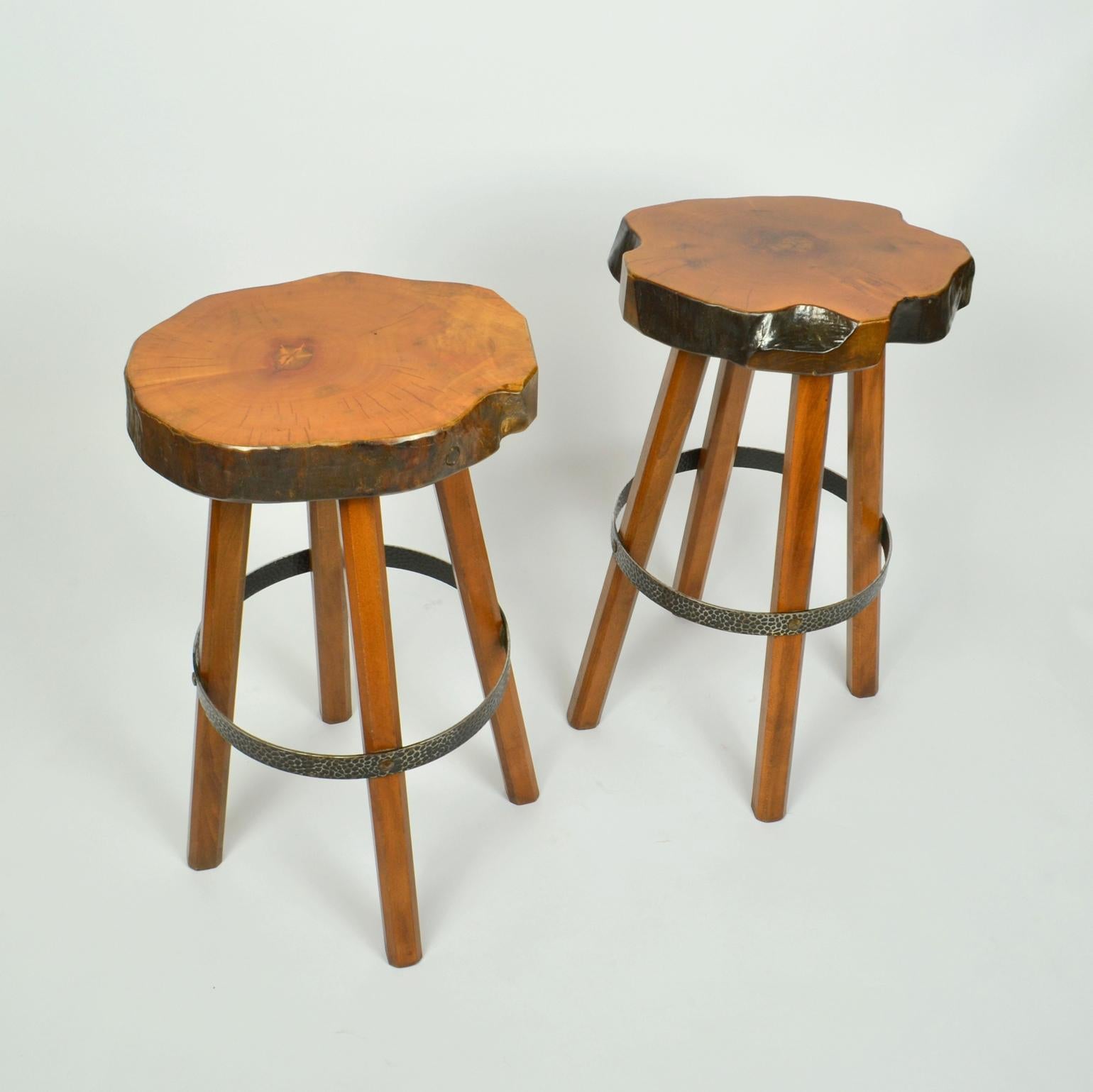 Handcrafted bar stools in Burr Elm wood. These unique stools have been handmade individually, therefore each stool is unique with a freeform shape seat using the natural contours of the wood. The voluptuous four legged high stools have a rustic