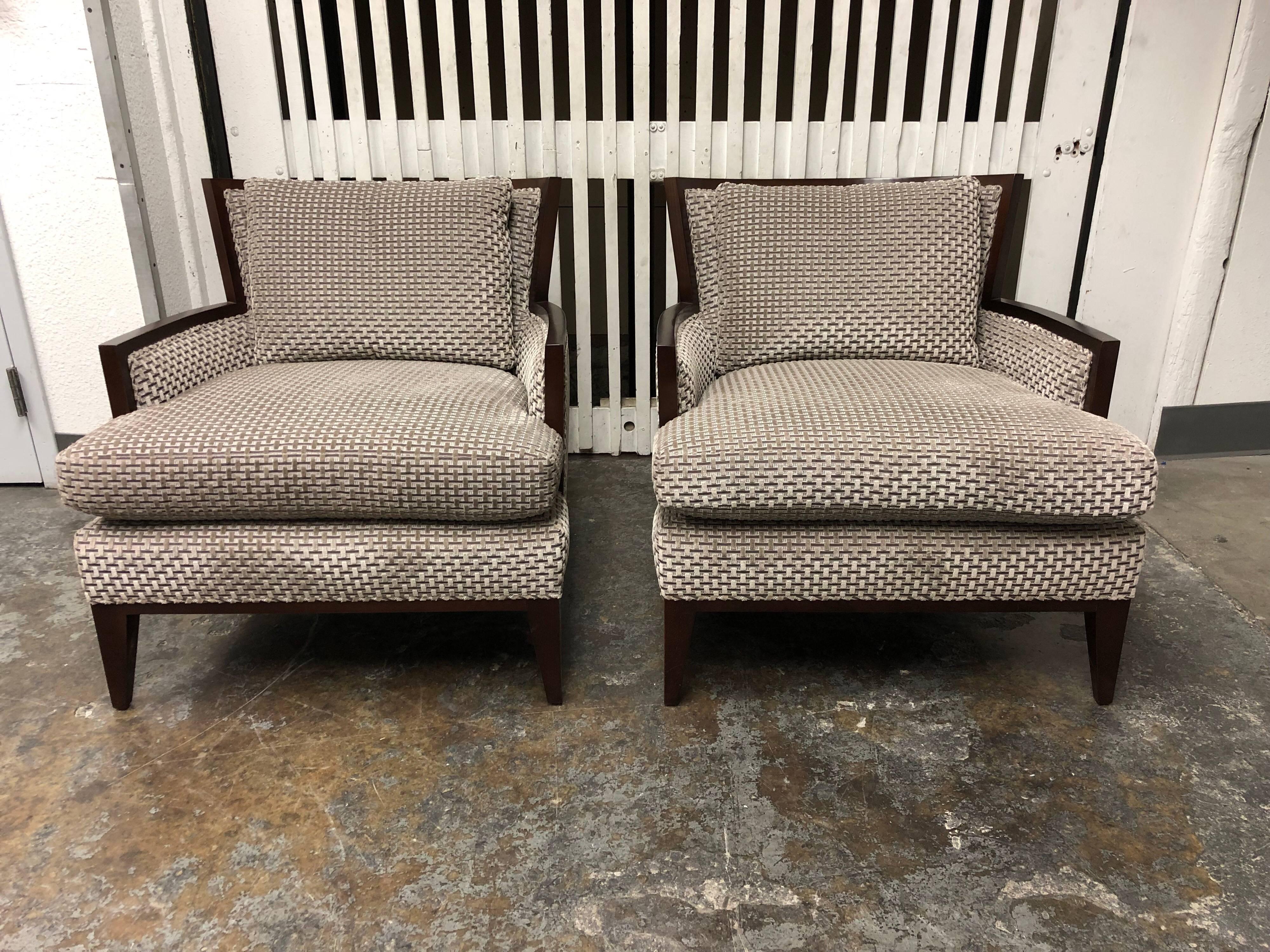 A pair of California lounge chairs by Baker furniture. Designed by Barbara Barry. upholstered in basket weave textured gray velvet fabric. The wood frame is in a brunette finish. Seating and back cushion are removable, cushions are feather down