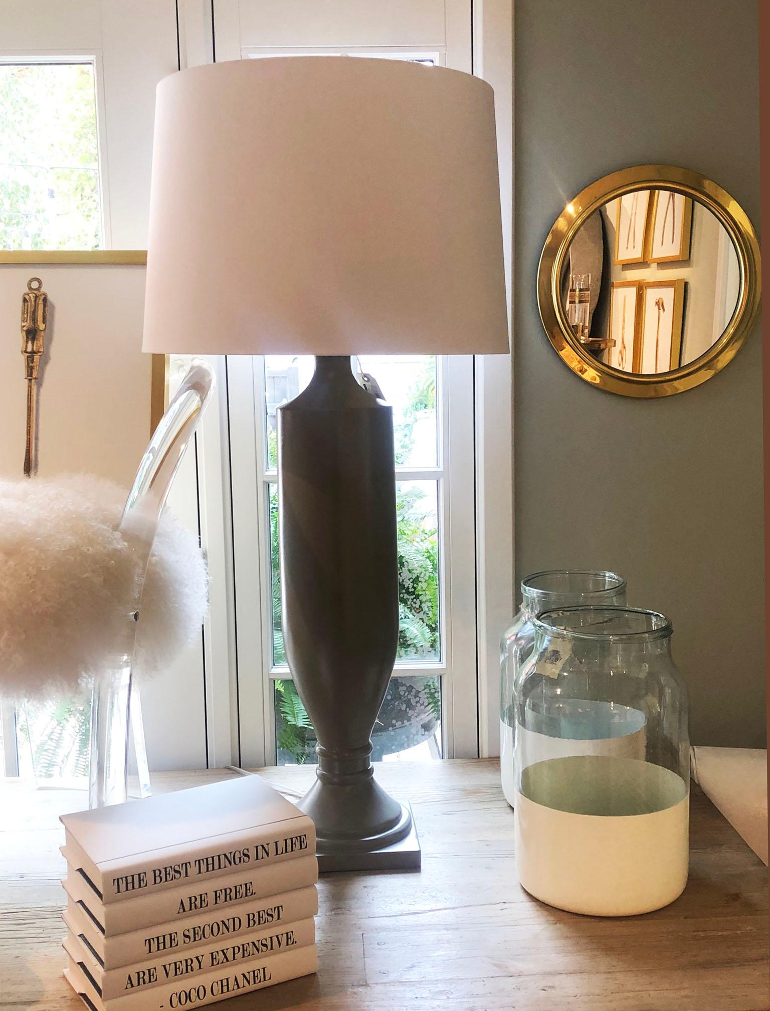 A pair of graceful and tall Estate lamps from Barbara Cosgrove. The lamps are painted in a medium gray with a tapered parchment shade included. They are very tall and make a beautiful statement to any buffet, table or bedside.

The measurements