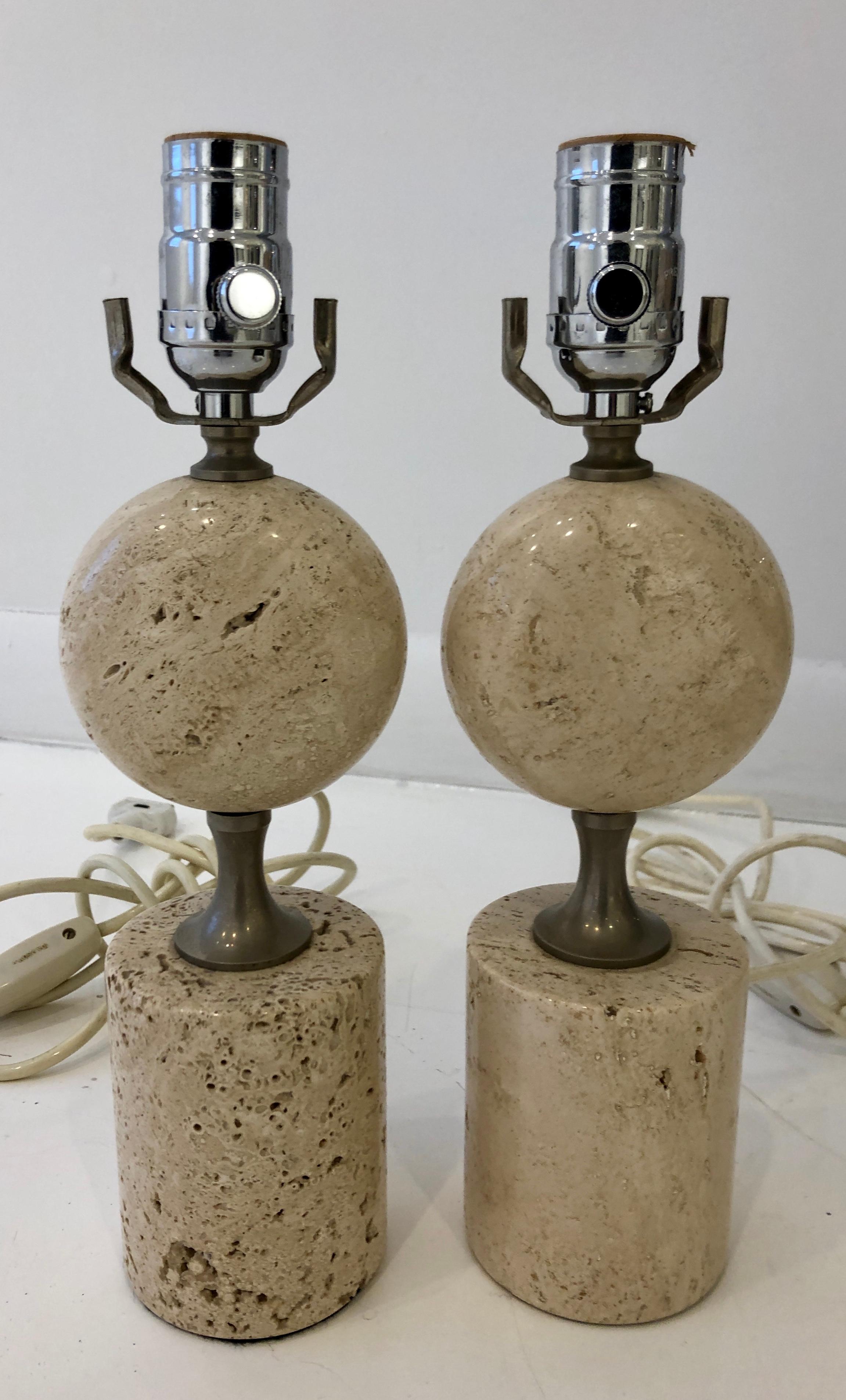Flattened travertine orb on cylindrical travertine pedestal with solid nickel hardware. Shades not included.

Lamps are 13 in. to top of socket, 10 in. to top of marble.