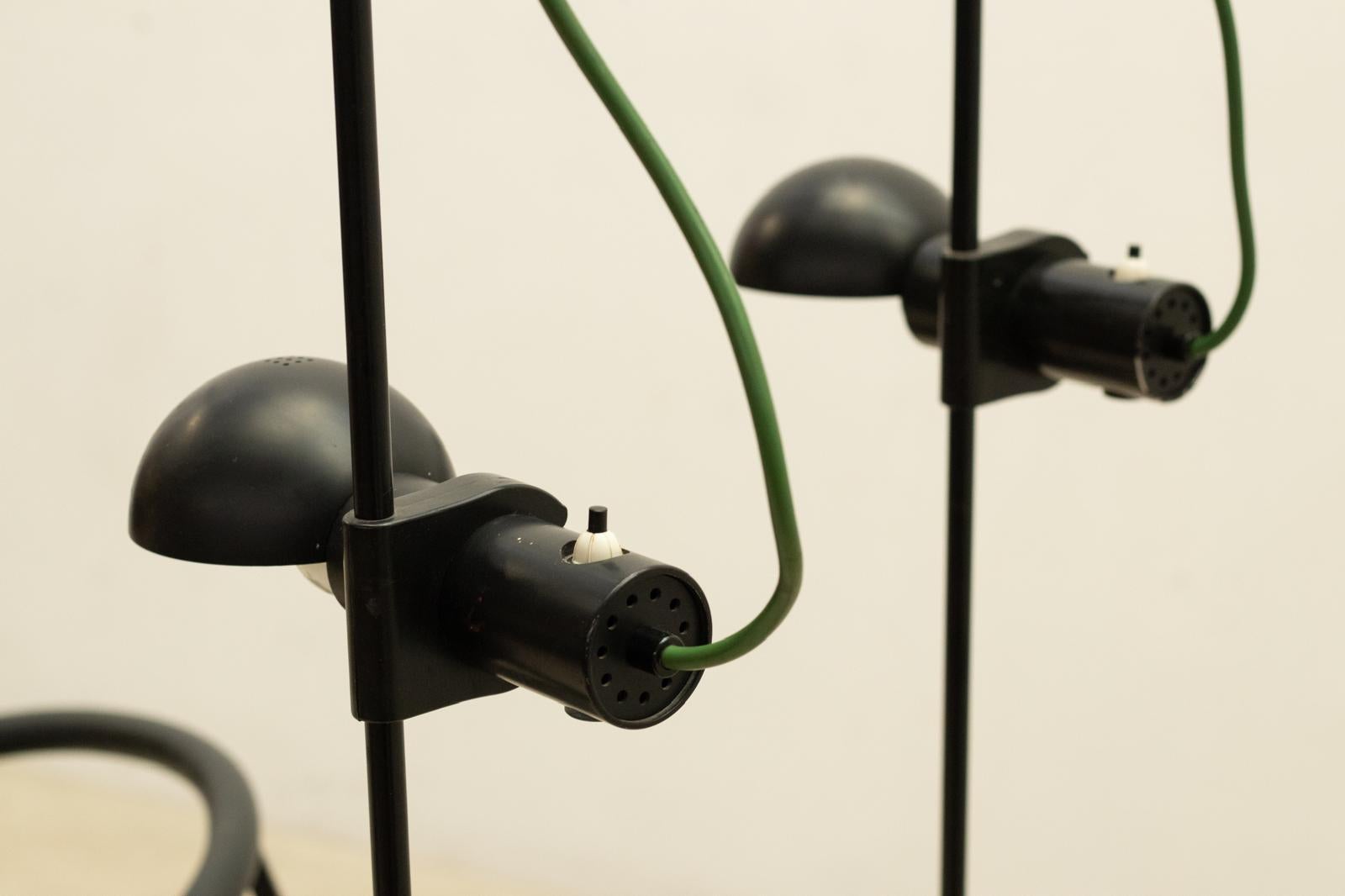 1970s Barbieri e Marianelli black floor lamp for Tronconi. 

Executed in black matte metal with green chord. the shade rotates left and right while the On/off switch is on the shade.

Theses sleek and bold lamp are reflecting the true luxurious
