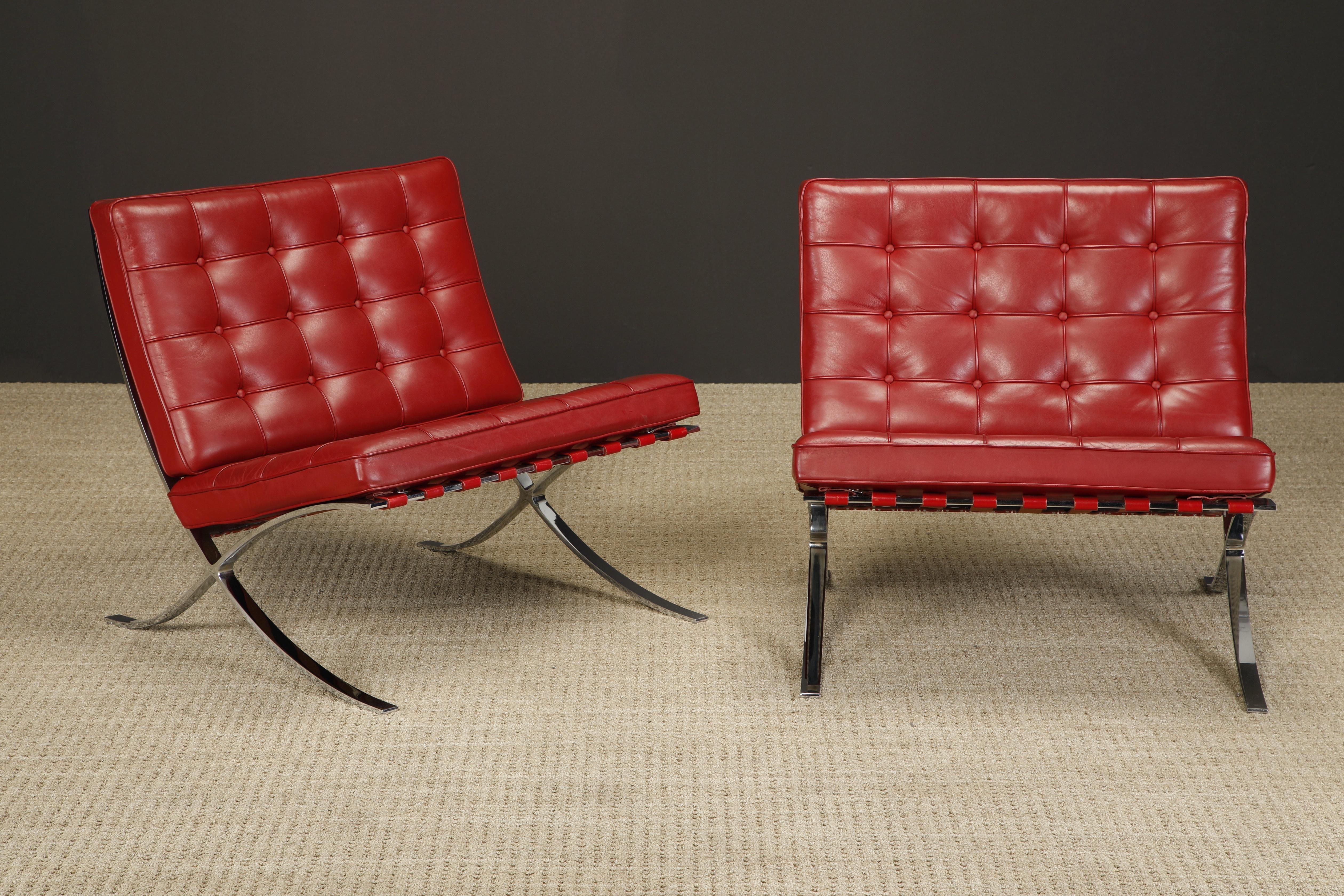 This pair of gorgeous burgundy leather 'Barcelona' lounge chairs by Ludwig Mies van der Rohe for Knoll Studios is double-signed on each piece, with Knoll Inc labels to the seat cushions and Knoll Studio embossing with Mies van der Rohe signatures