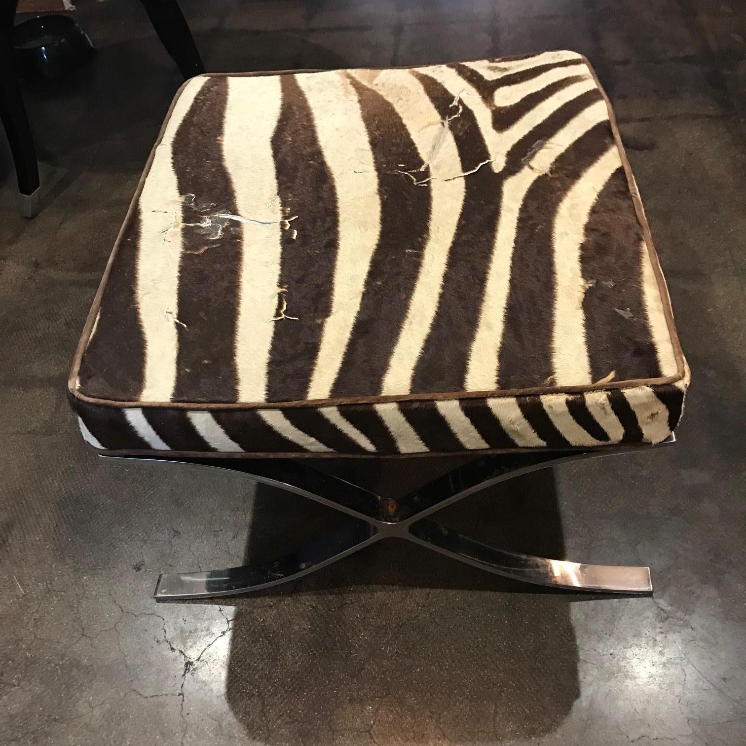 Ultra chic pair of vintage Barcelona stools in polished chrome upholstered in genuine zebra hide. Modern luxe.