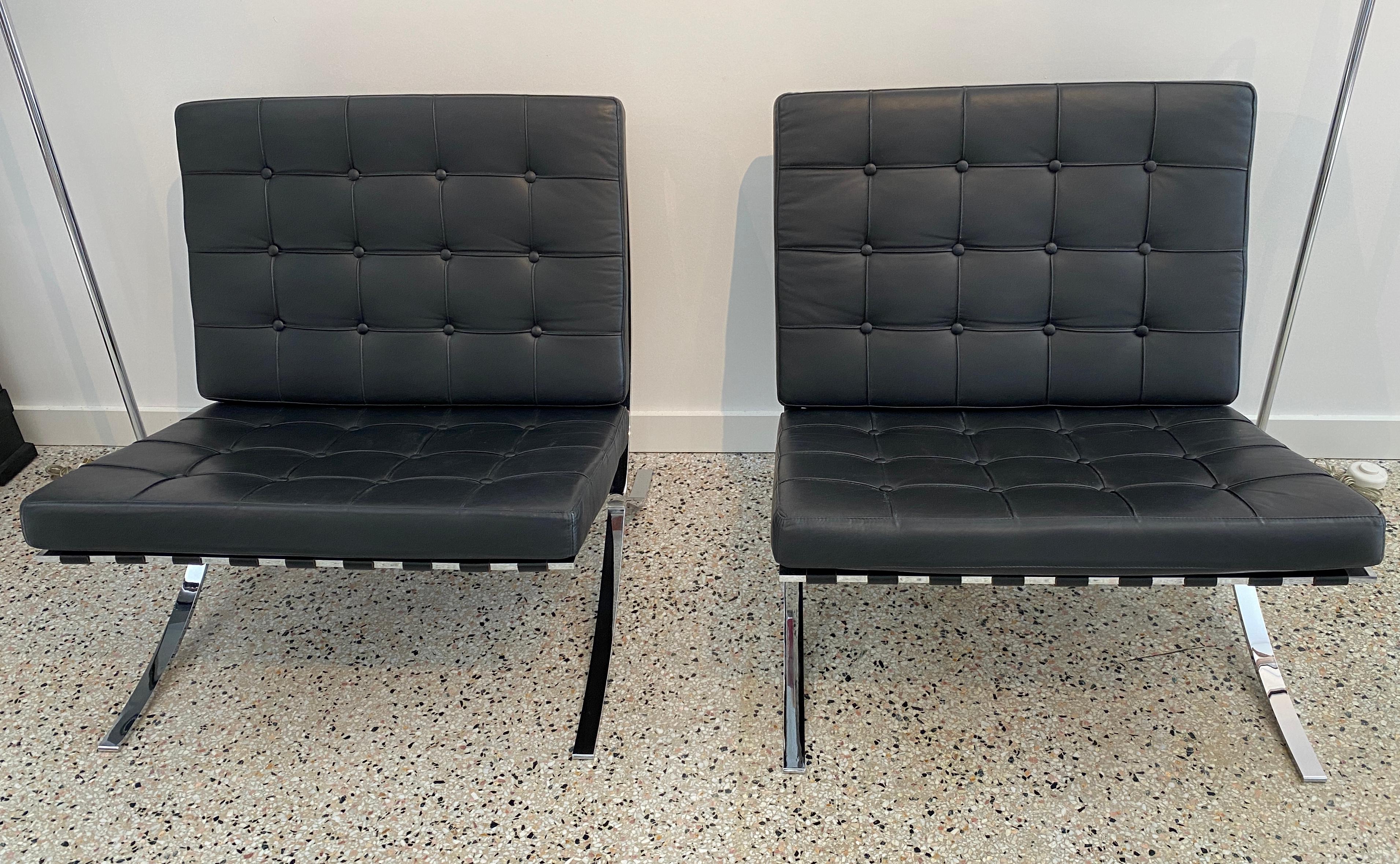 This stylish pair of Barcelona style chairs date to the 1980s and were manufactured by Fascm International.  The pieces capture the true form and use of materials as the original Mies van der Rohe.

The frames are steel with a polished chrome