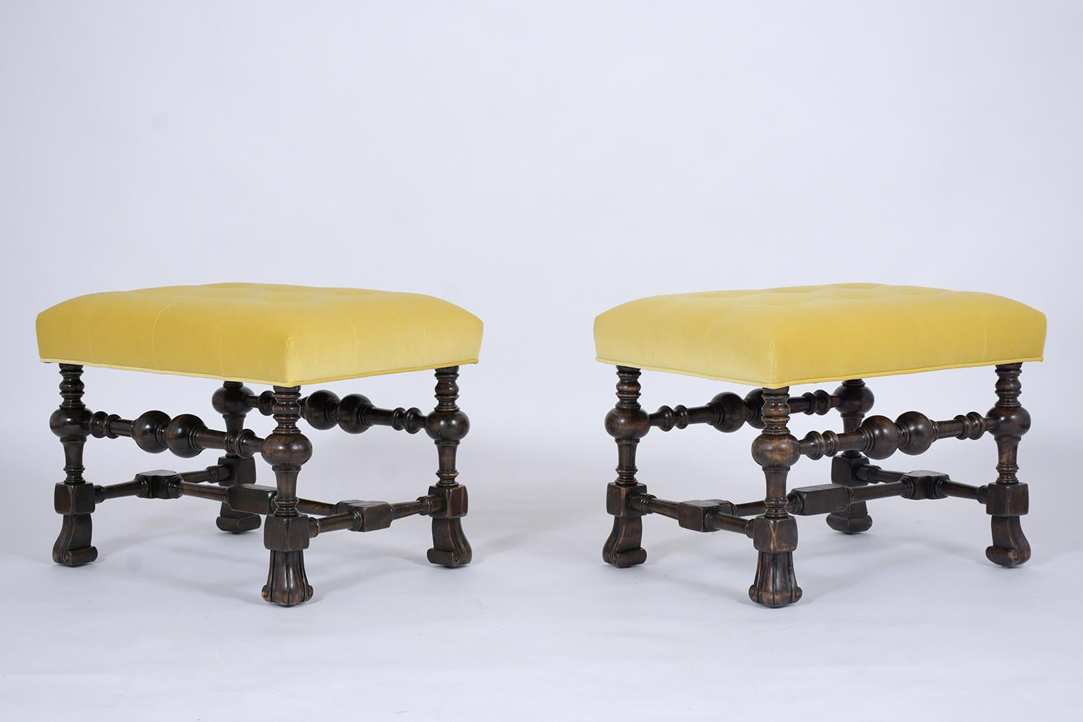 An eye-catching pair of Baroque Ottomans crafted out of walnut wood with a newly lacquered finish and have been fully restored. The pair is newly upholstered in a yellow color velvet fabric, new foam inserts with a tufted cushion design, and