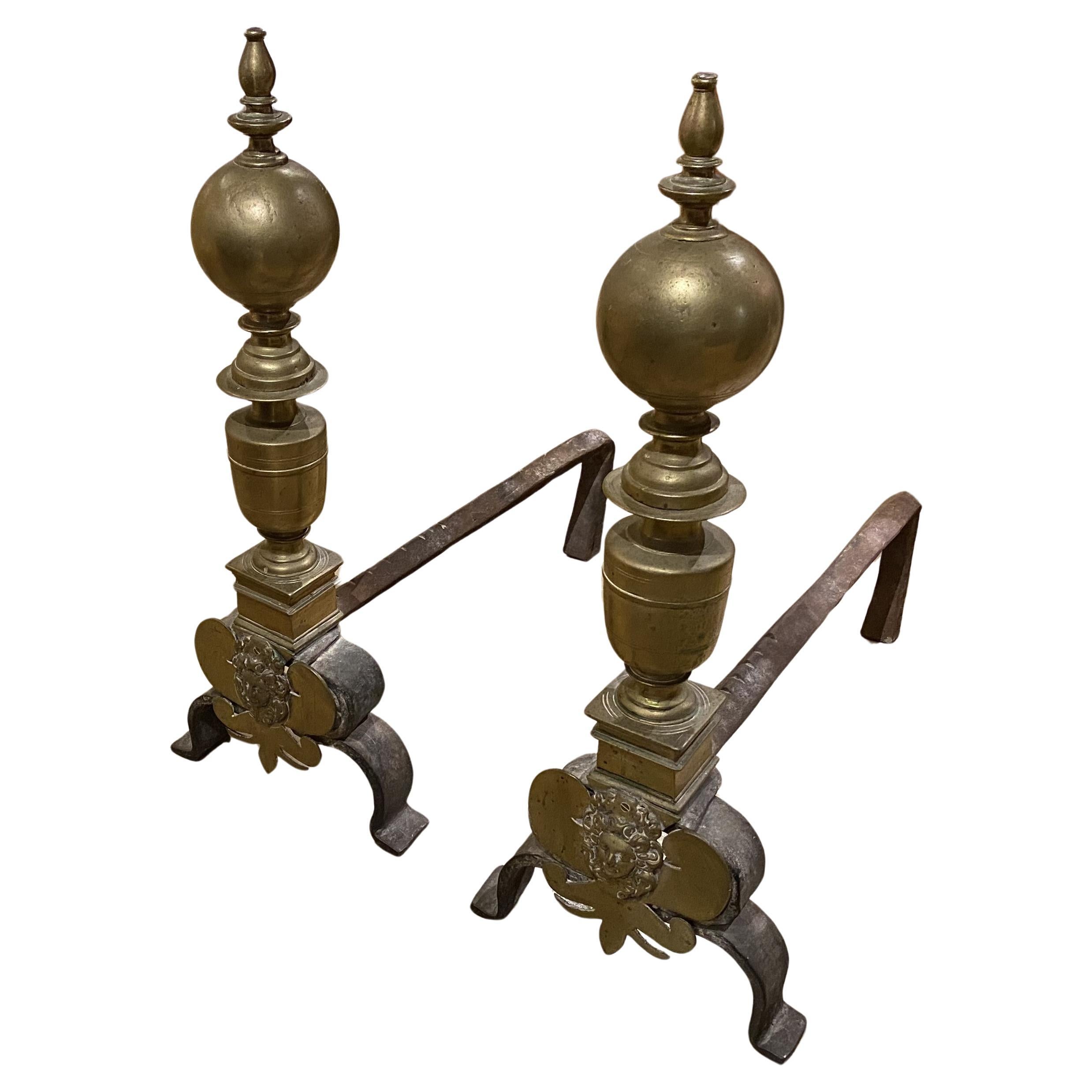 Pair of Baroque Brass Andirons with Face Decoration For Sale