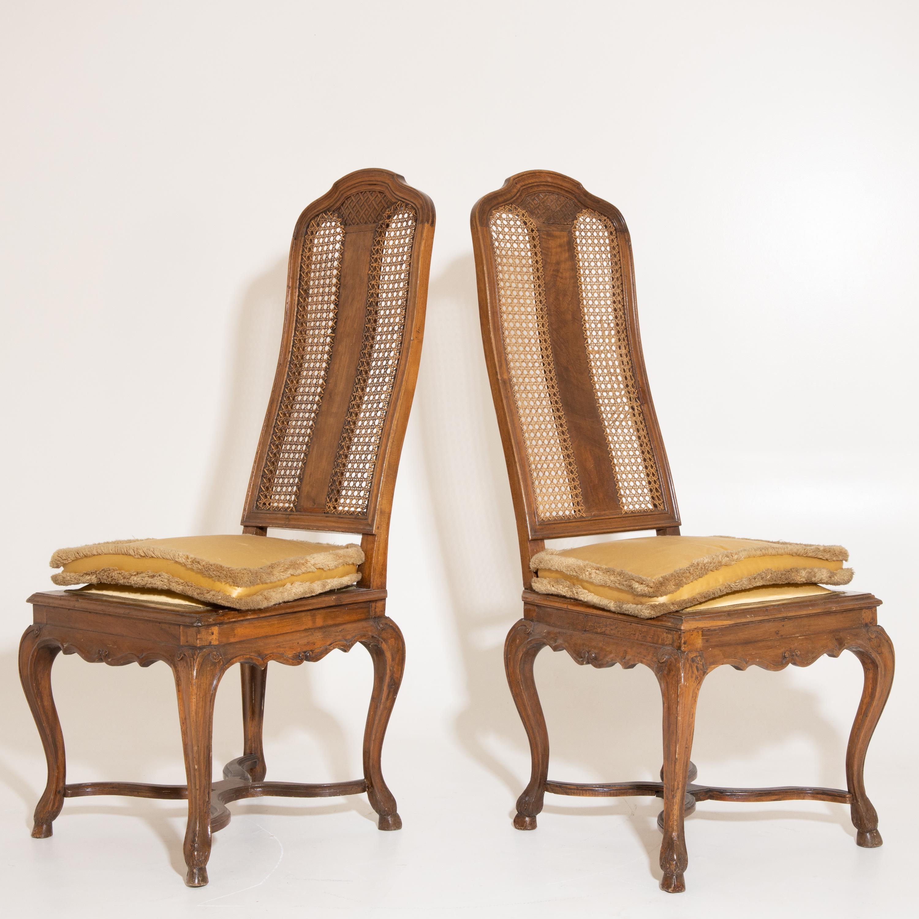 The pair of tongue chairs have a trapezoidal seat. The backrest is mouloured and covered with a jonce weave. Literature: Sotheby's, The Collection of the Margraves and Grand Dukes of Baden, Auction Baden-Baden 5. to 21. October 1995, p. 10, Tf. II,