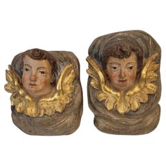 Pair of Baroque high reliefs of Angels, Cherubs, polychrome and gilded wood