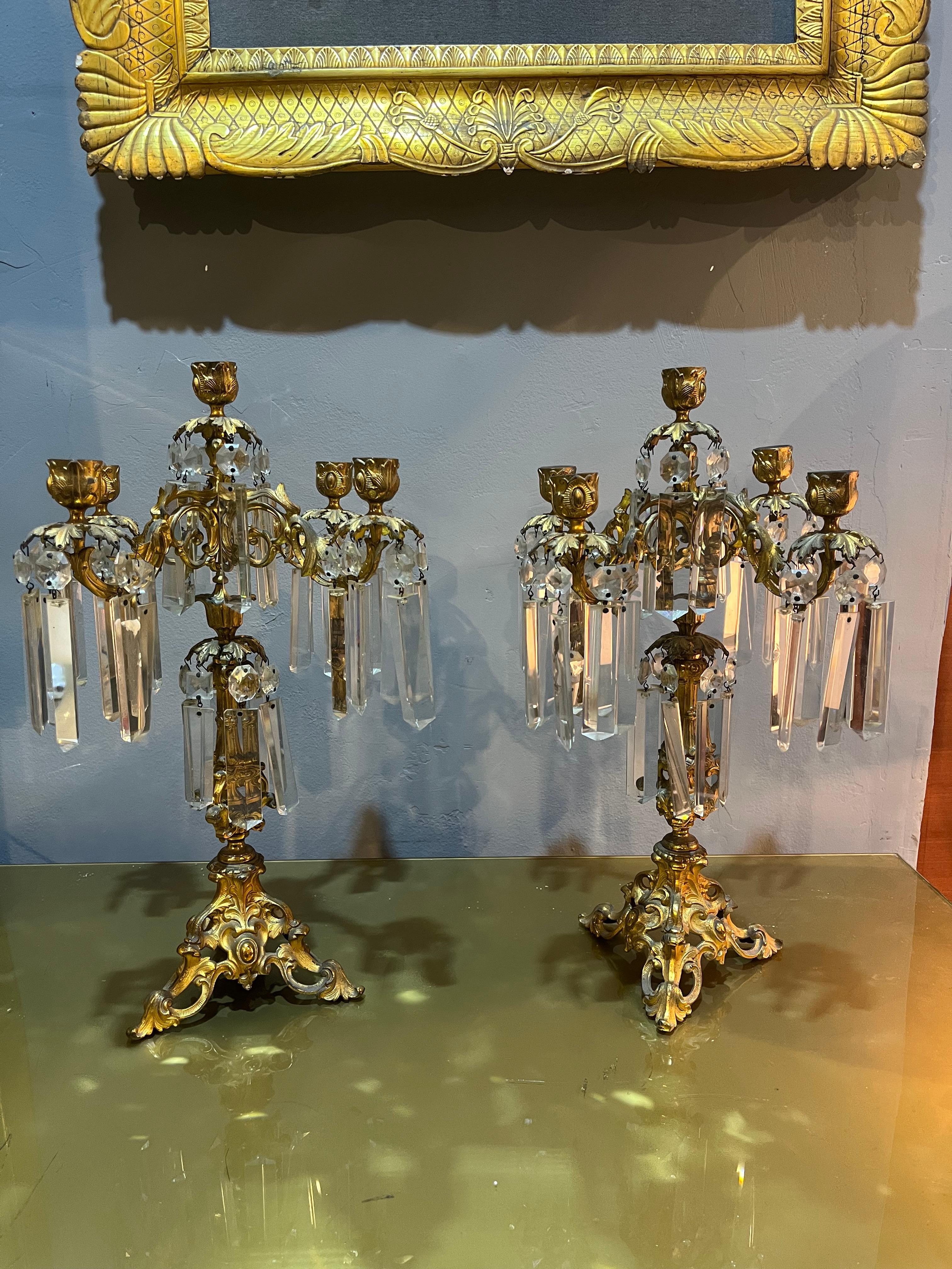 Pair of baroque style candlesticks. Product in good condition with small wear caused by use and time. The term 