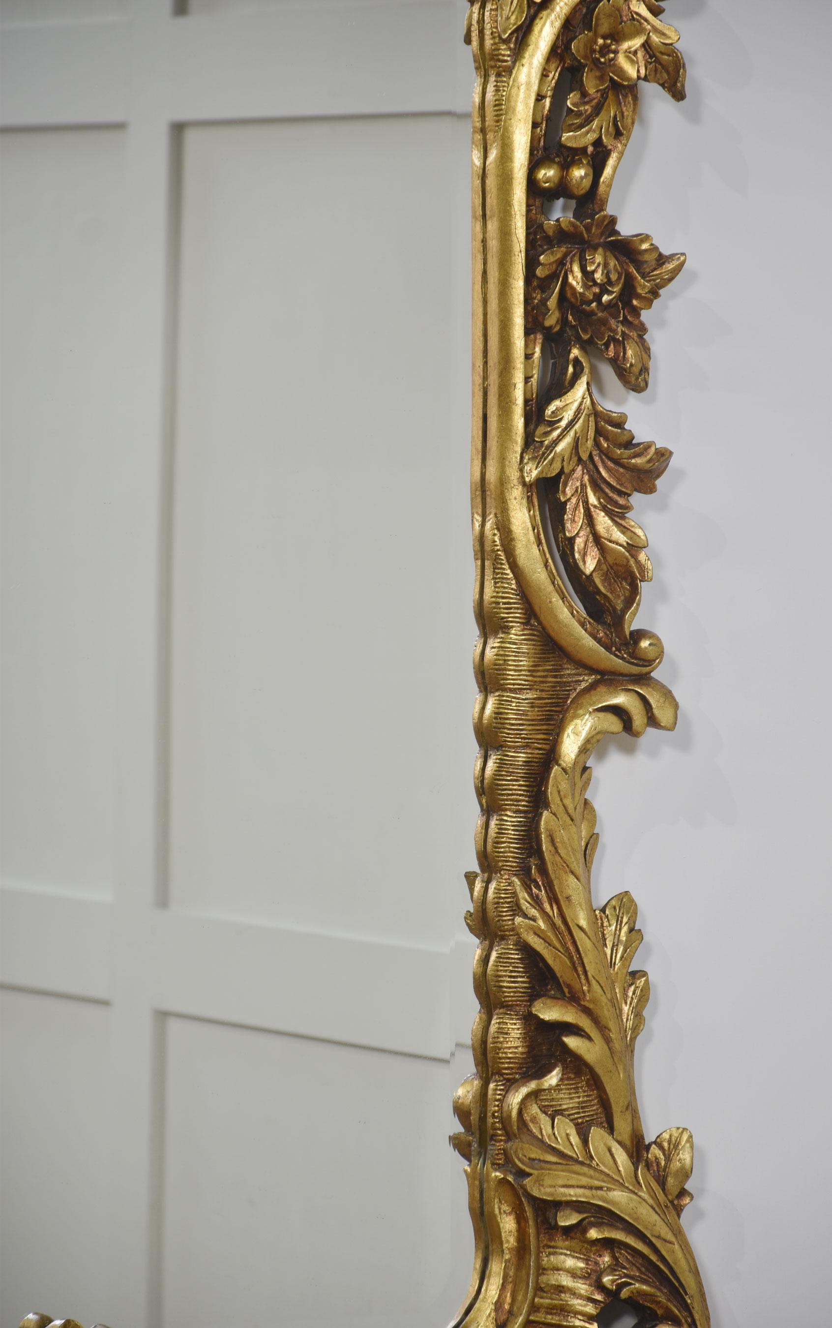 20th Century Pair of baroque style carved and gilded mirrors For Sale