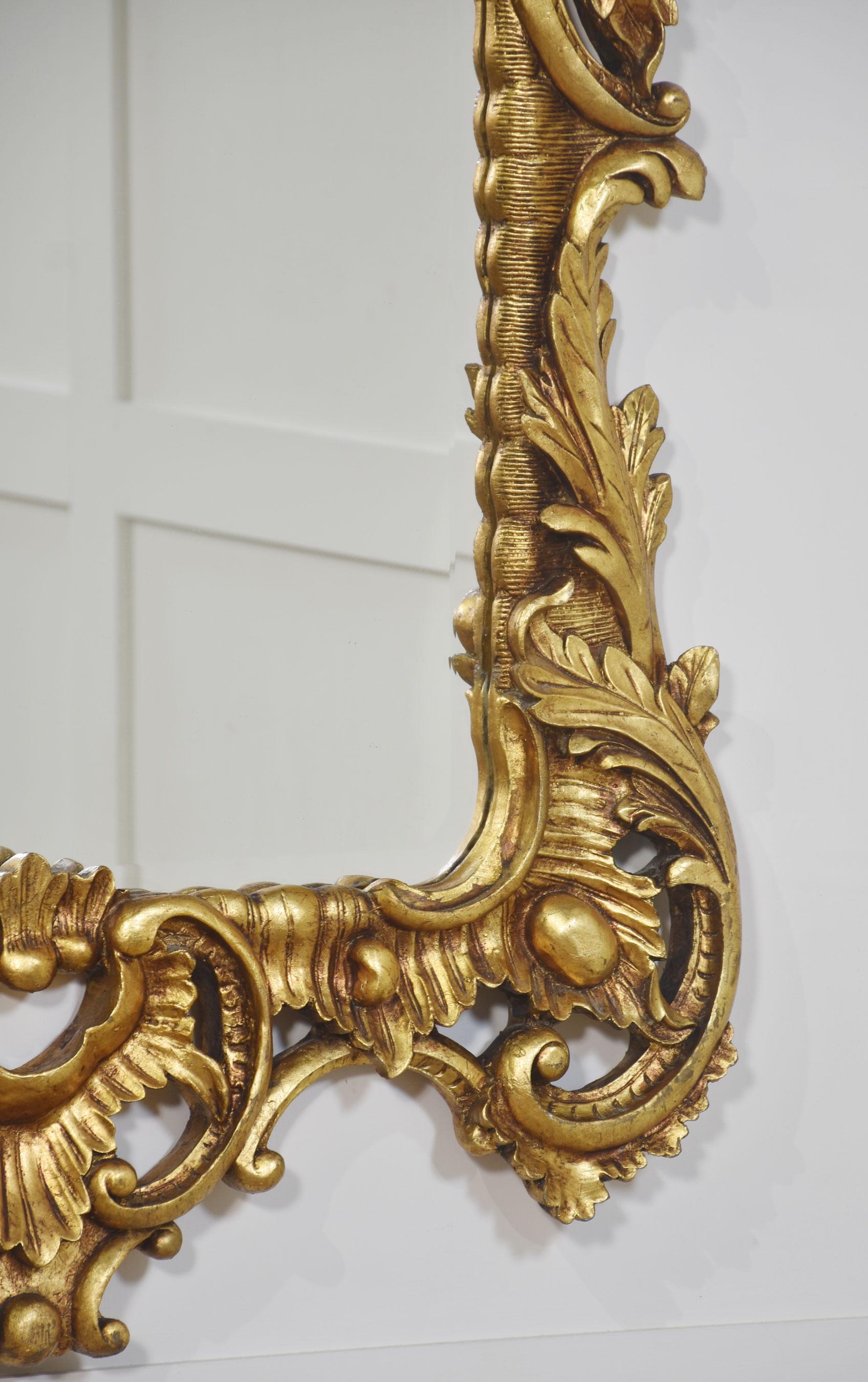 Giltwood Pair of baroque style carved and gilded mirrors For Sale