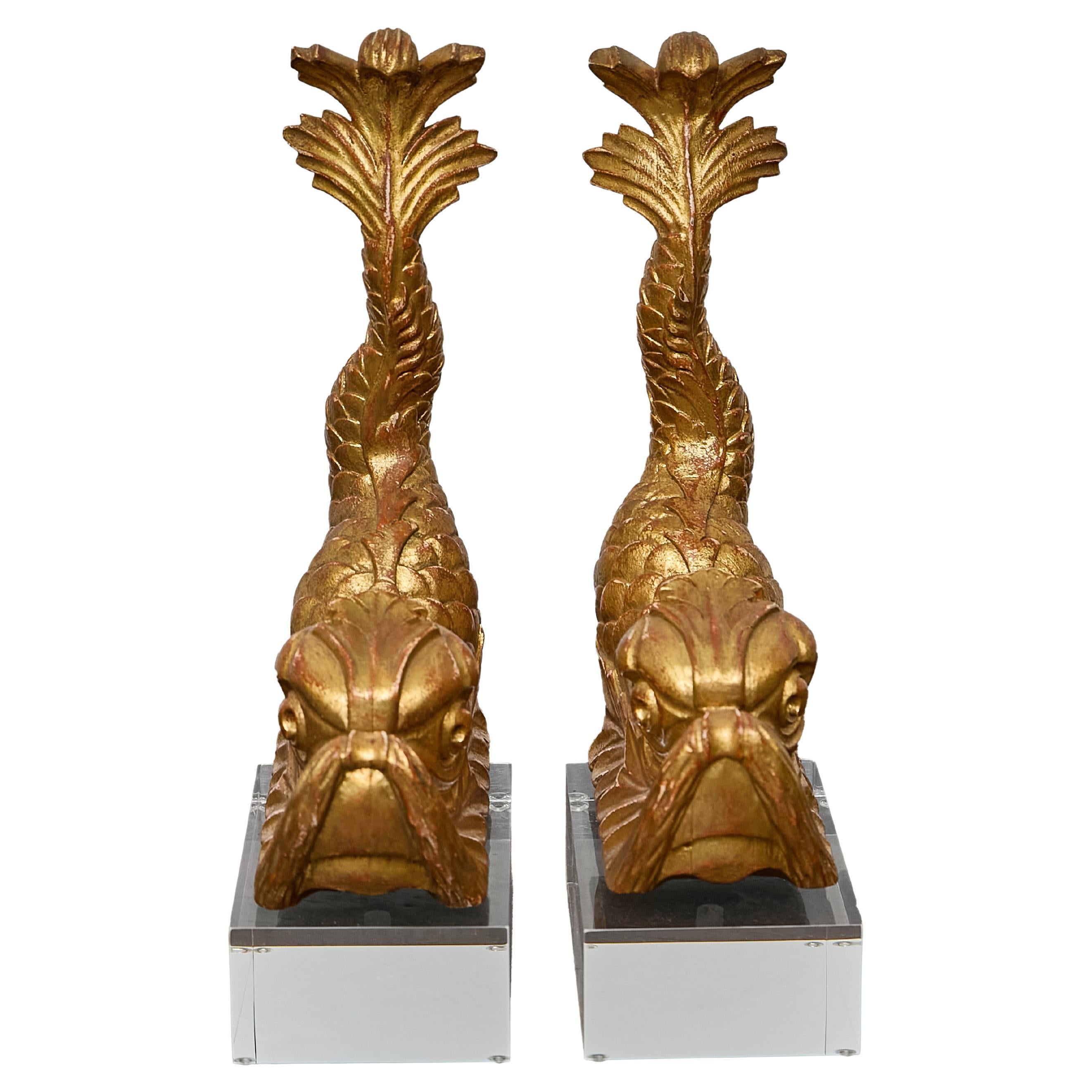 Pair of Baroque Style Giltwood Dolphin Carvings on Lucite Bases, 19th century