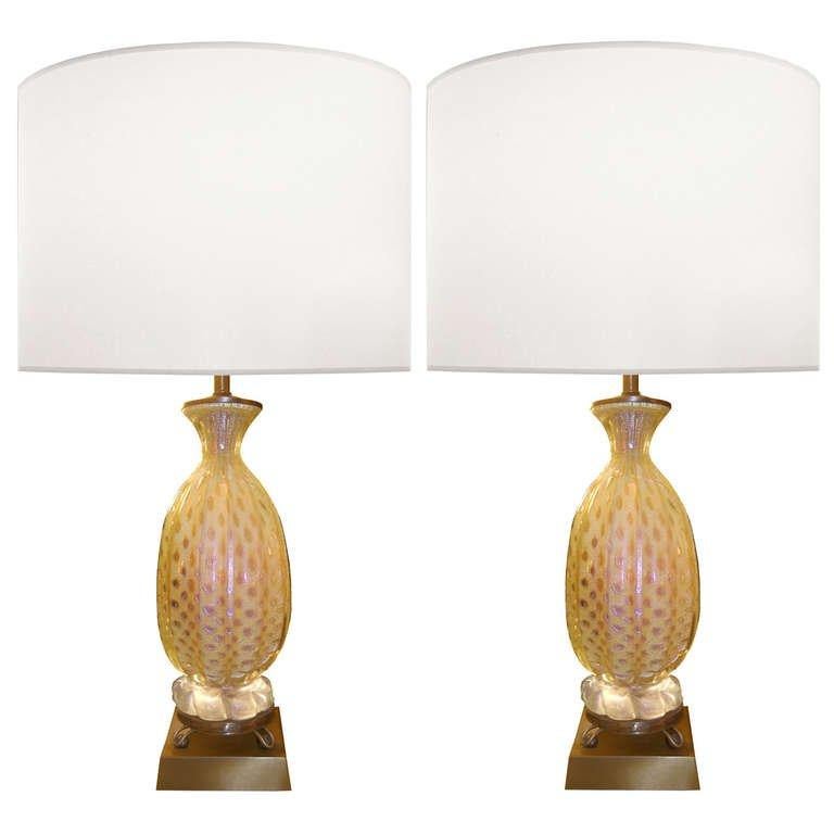 A pair of fluted glass lamps in iridescent yellow and amber and colored speckles throughout glass resting on a bronze base by Barovier & Toso.

Italian, Circa 1950's

Lamp Shades Are Not Included.

If you are interested in Lamp Shades, please email