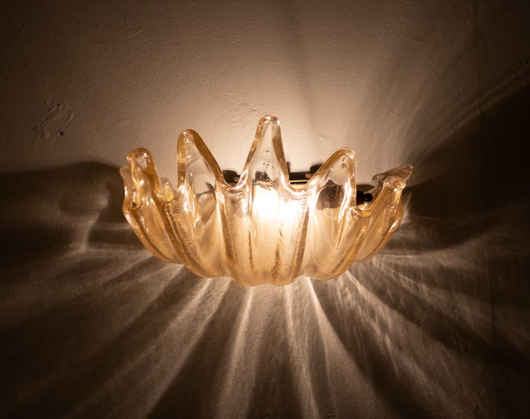 Ercole Barovier for Barovier & Toso rare pair of large clamshell sconces in heavy transparent iridescent glass featuring deep ribbing and pronounced lobes, Italy, circa 1940. These exquisite hand blown crystal wall lights are elegant and impressive