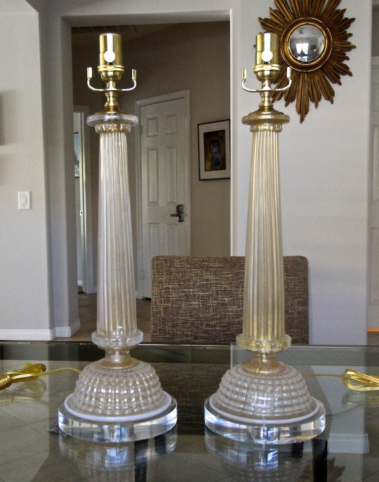 Pair of column shaped Murano table lamps by Ercole Barovier Toso. The column portion is ribbed with gold inclusions, the bases are done in the 
