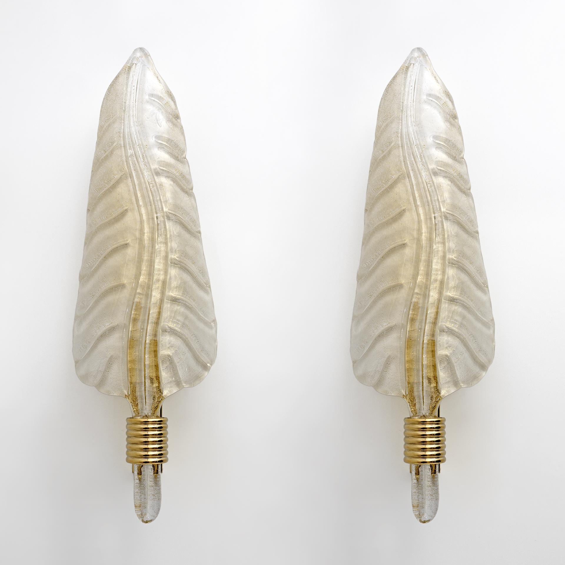 Pair of blown Murano glass appliques in the style of Barovier & Toso, Italy, 1980s. The sconces have brass supports; Murano glass has a light, transparent gold color with inclusions of gold dust. The wall lights have one light each and are equipped