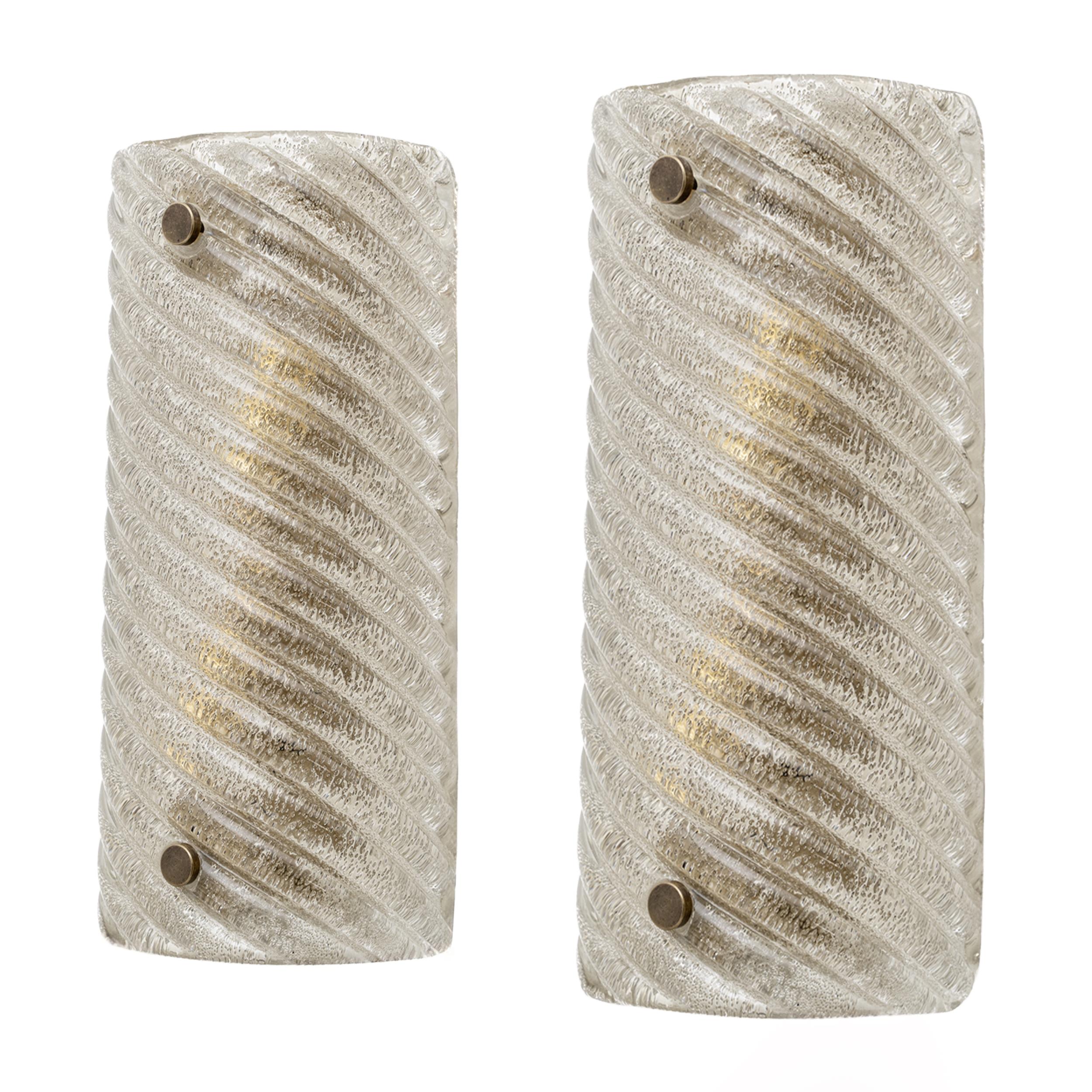 Pair of Smoked Murano Glass Wall Lights with Wavy and Twisted Pattern. We love the simple lines of this pair and the beautiful texture of the hand blown glass. Each wall light requires two E14 or E12 bulbs. Wiring complies with US and European
