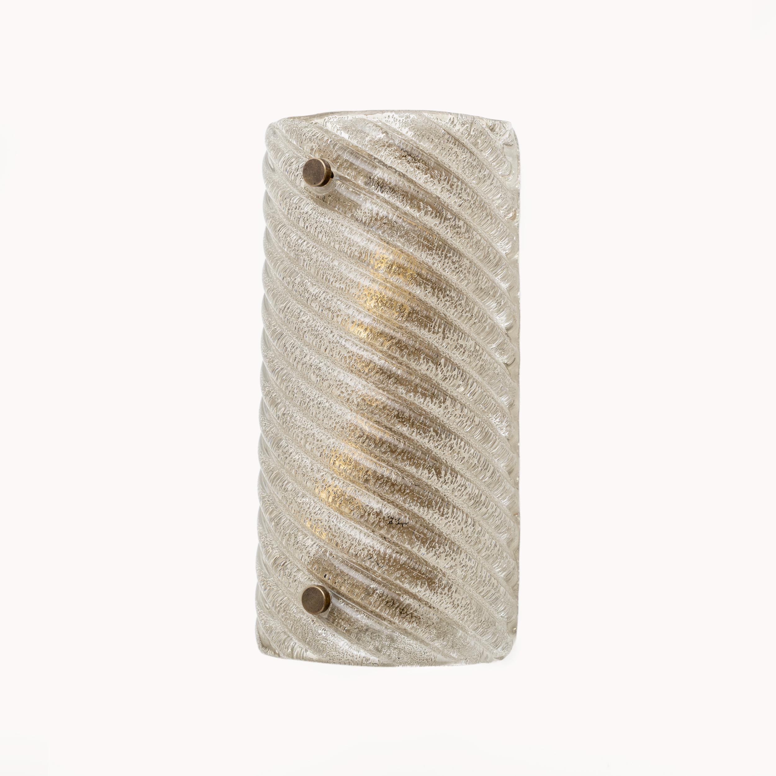 Pair of Smoked Murano Glass Wall Lights with Wavy and Twisted Pattern. We love the simple lines of this pair and the beautiful texture of the hand blown glass. Each wall light requires two G9 bulbs. Wiring complies with US and European