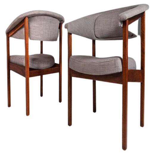 A highly collectible model designer by Arthur Umanoff for Madison Furniture. The legs and seat frame are constructed from brilliant cuts of walnut. The contoured back is rests perfectly inside it's walnut frame. The chairs have the original blue /