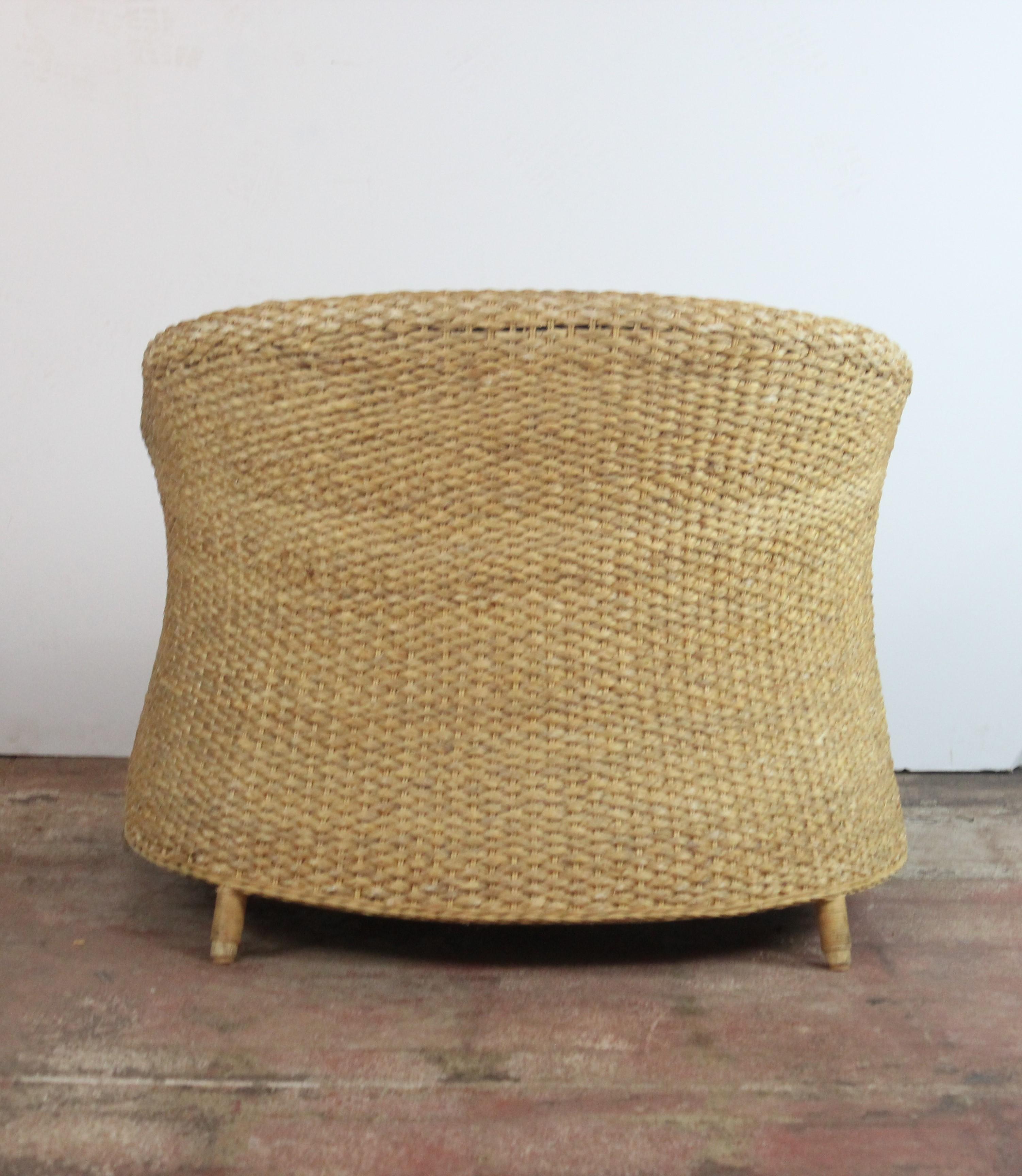 Straw wicker woven rush barrel back chairs. Loose cushion covered in linen.