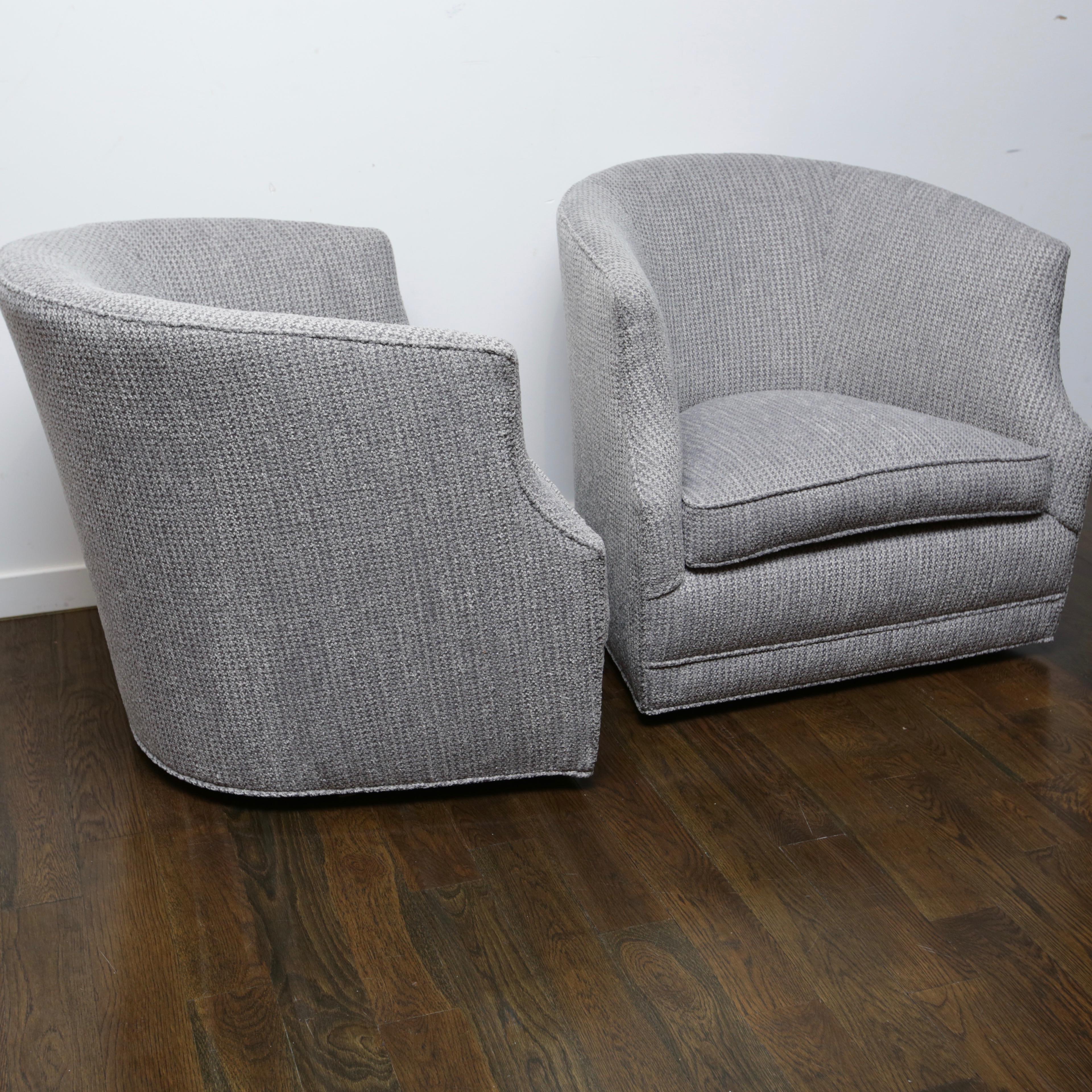 These swivel chairs have a unique, slightly higher than normal seat back. Just recovered in a soft, grey, hounds tooth pattered fabric.