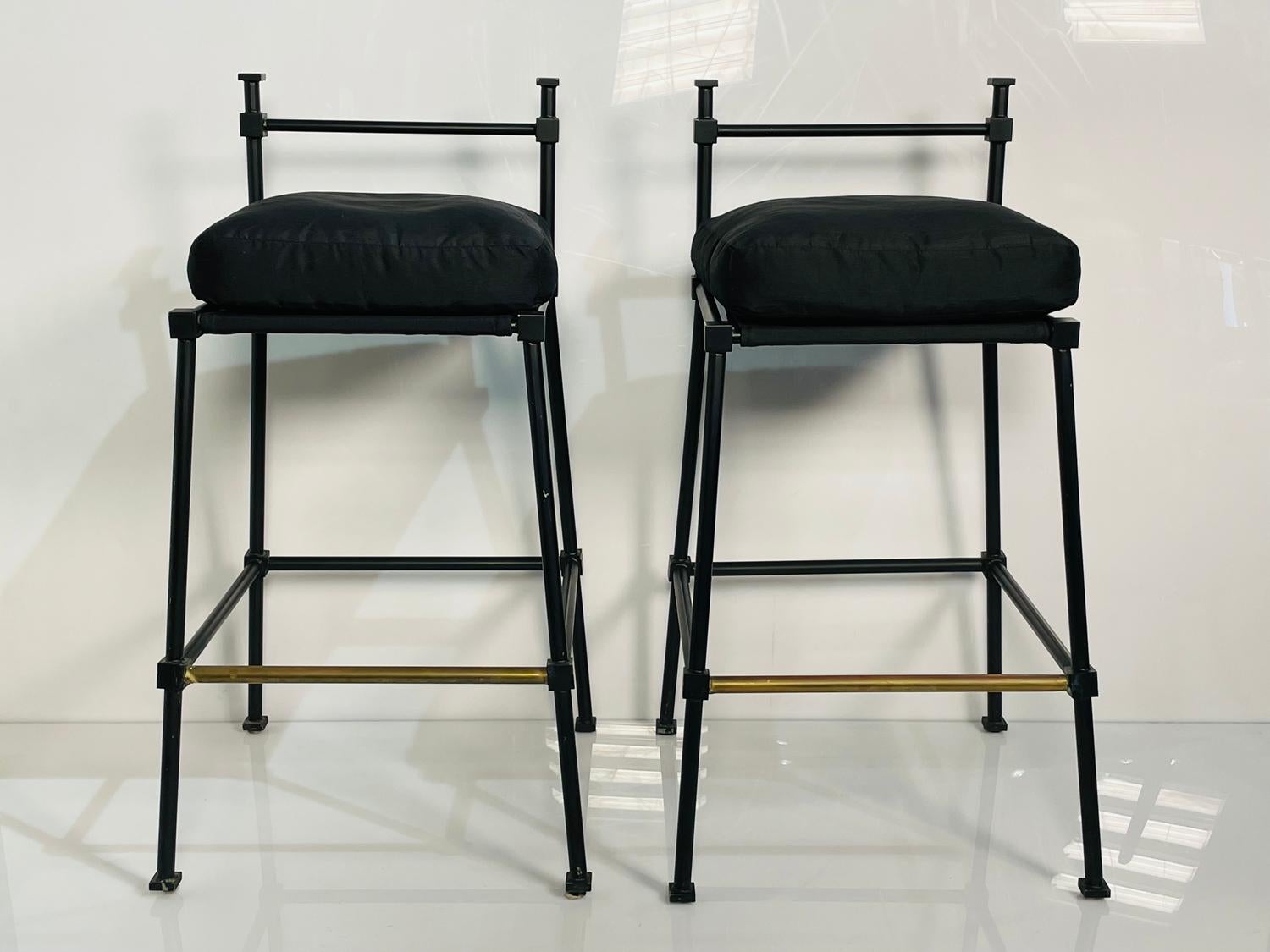 Beautiful pair of barstools made in solid steel with a black powder finish.

The stools are heavy and well made.

Measurements:
35 inches high x 19 inches wide x 19 inches deep x 29 inches seat height.