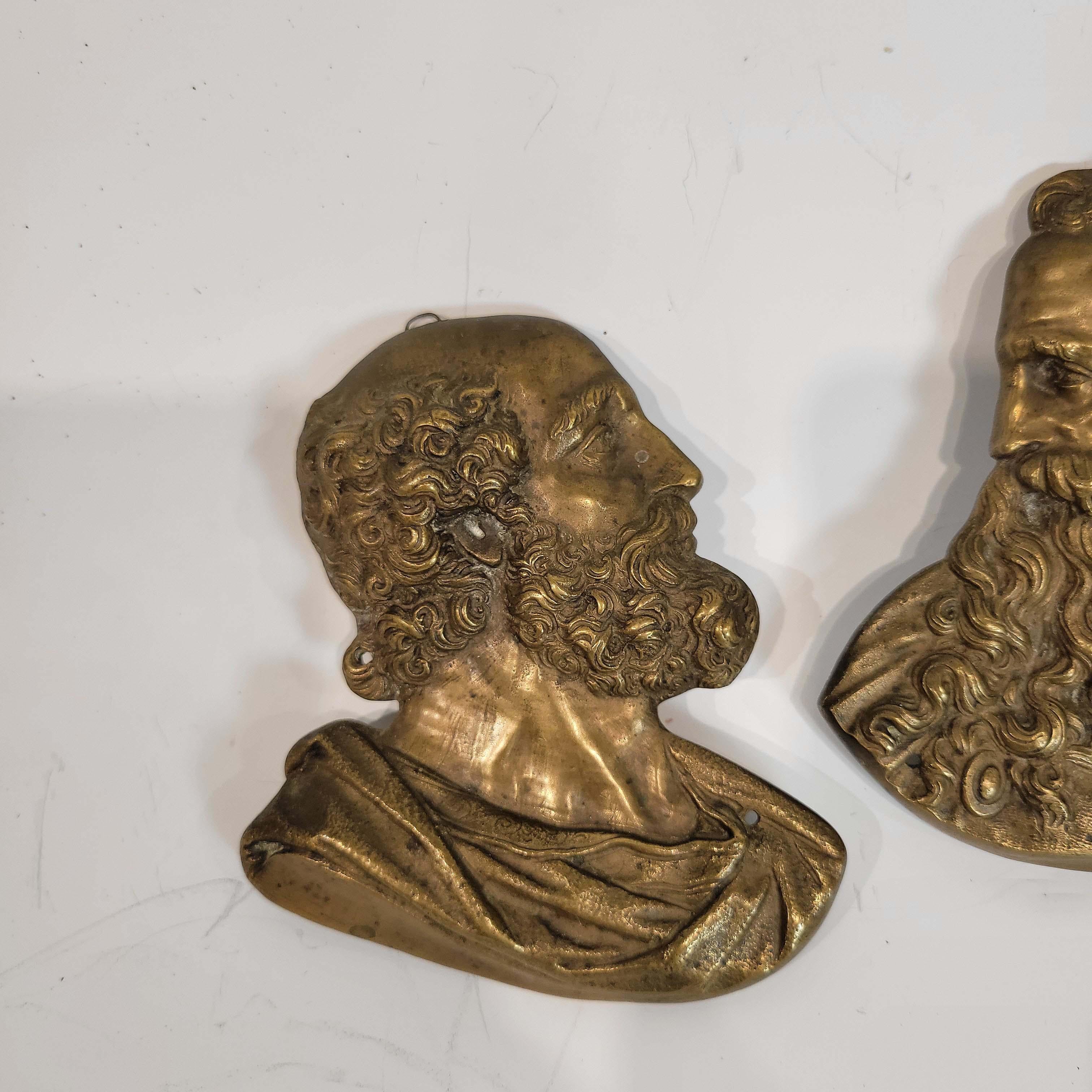 Beautifully cast and chased in renaissance manner. There are two holes in each plaque , one behind their garment and one behind their heads, probably for mounting at one time. Solid bronze, lost wax casting technique.