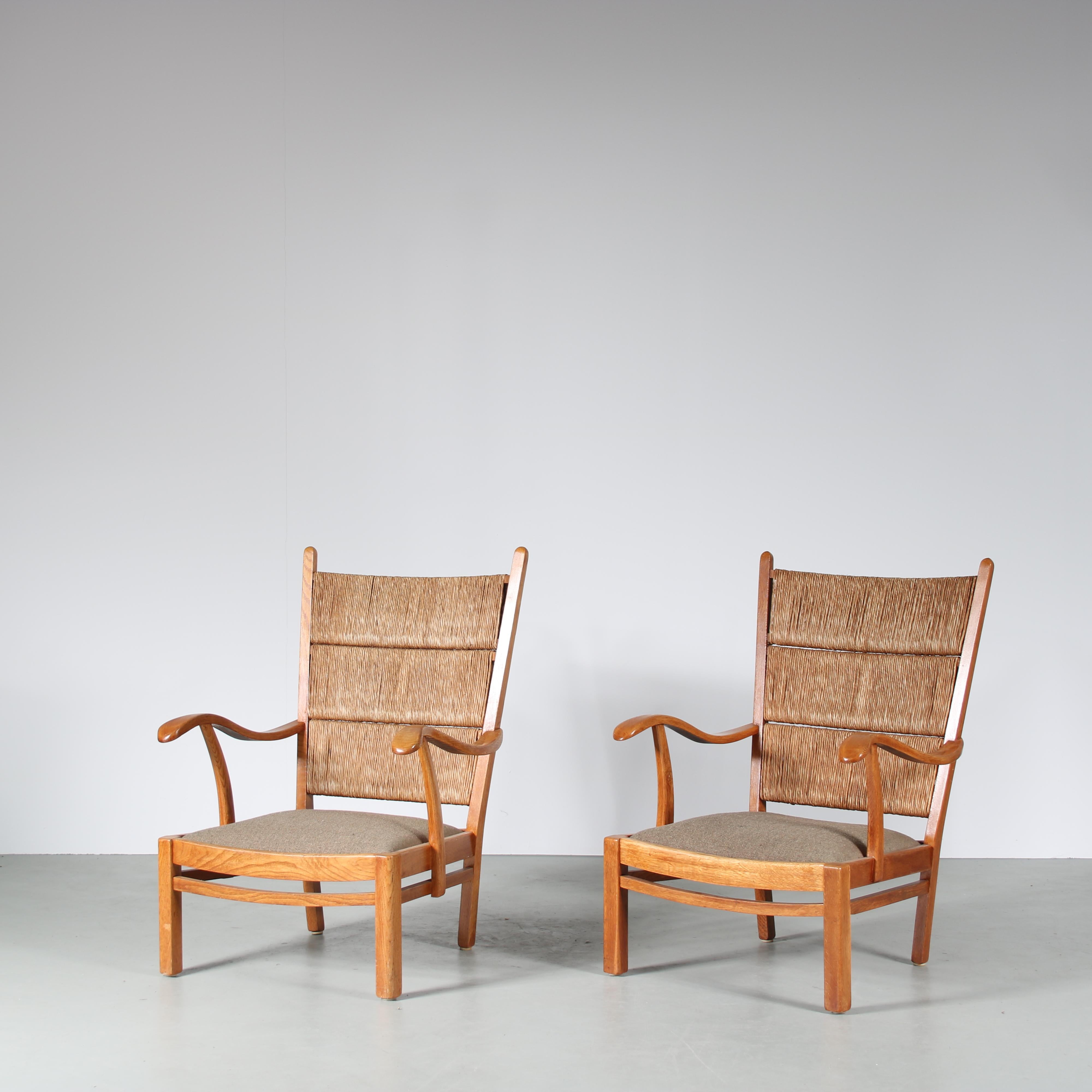 A beauitful pair of easy chairs designed by Bas van Pelt and manufactured by MyHome in the Netherlands around 1950.

Both chairs are made of beautiful quality oak wood. The seats are upholstered in fabric and the backrests and upholstered in rush,