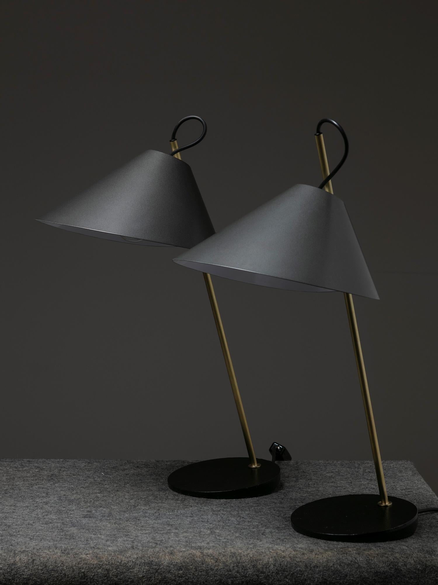 Set of two Base Ghisa table lamps by Luigi Caccia Dominioni for Azucena.
Cast iron base supporting a thin brass stem with adjustable metal shade.
 