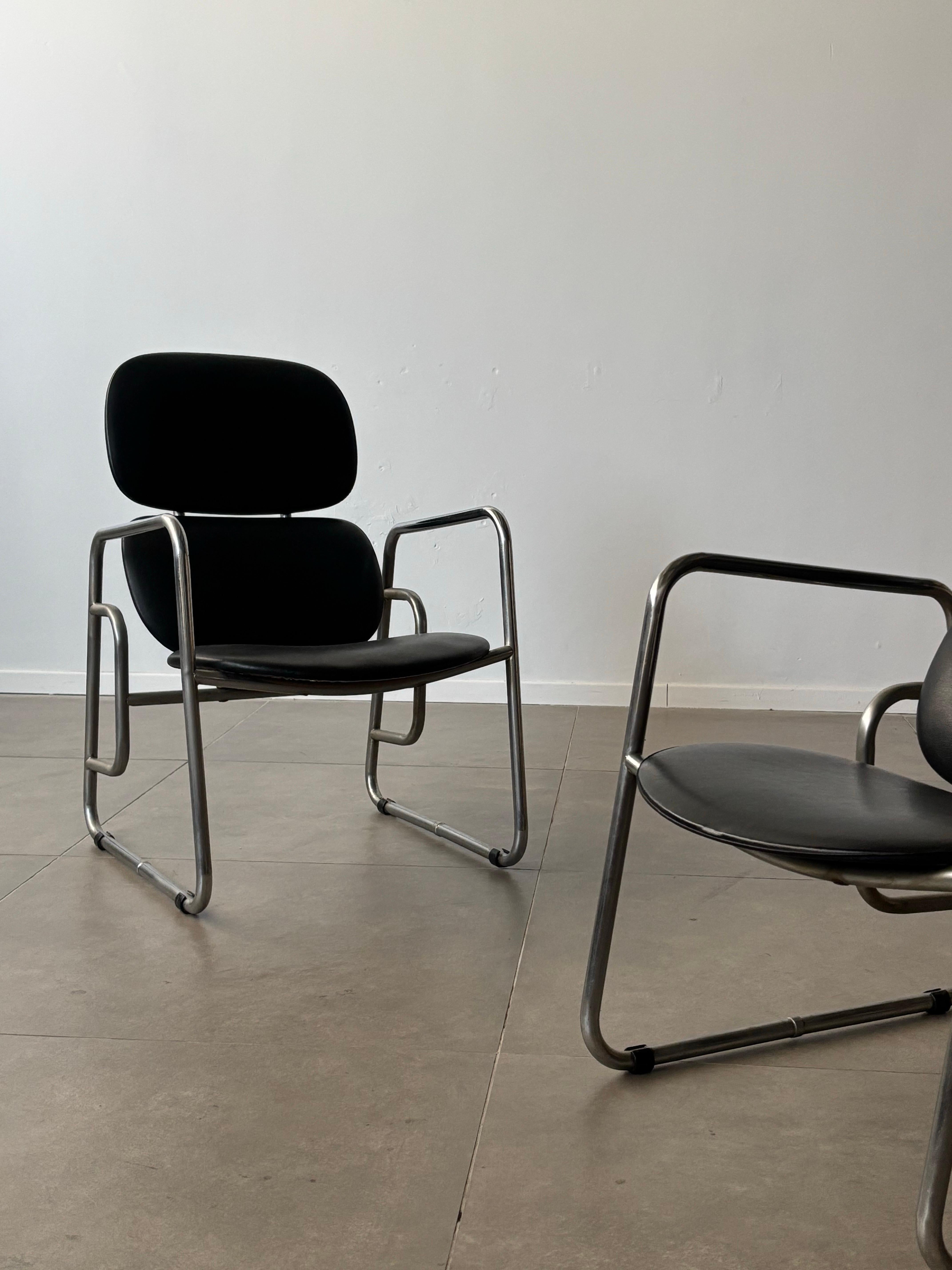 This pair of Bauhaus armchairs, crafted in 1970s Italy, embodies the movement’s dedication to functional elegance and minimalist design. Featuring a sleek tubular chrome frame, these chairs exude a sense of lightness while maintaining structural