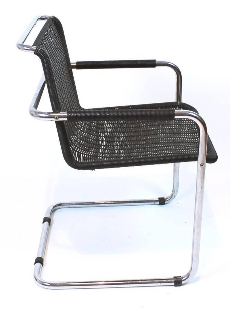 Pair of vintage bauhaus black armchairs by Tecta. Chairs are very comfortable with Cantilever seating, chromed frames. Good  condition, wear consistent with age and use.
