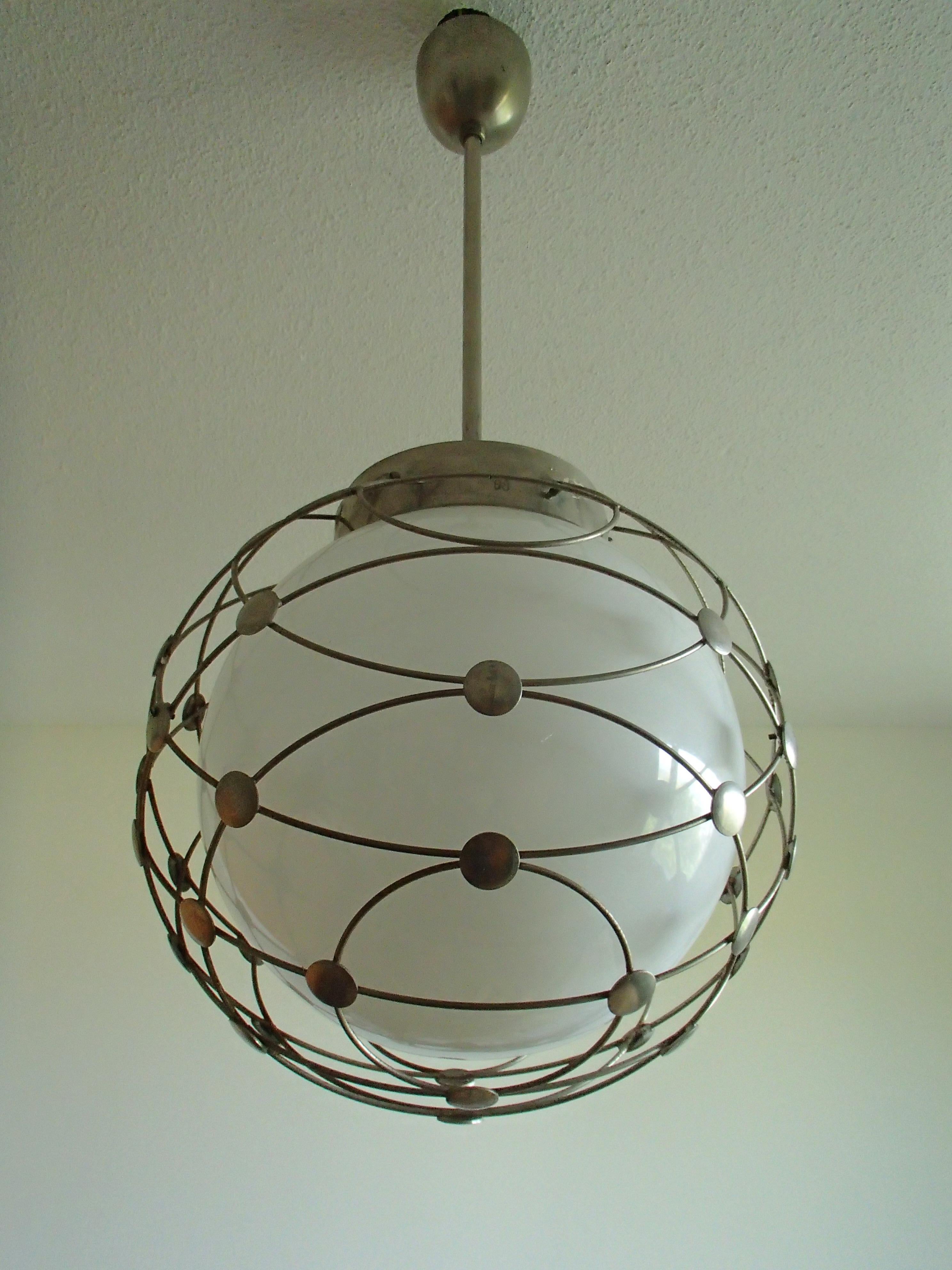 Pair of Bauhaus chandeliers white round opal glass covered with geometrical mesh, made for the Kongresshaus in Zürich.