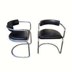 Pair of Bauhaus-style armchairs chromed steel frame and black leather seat